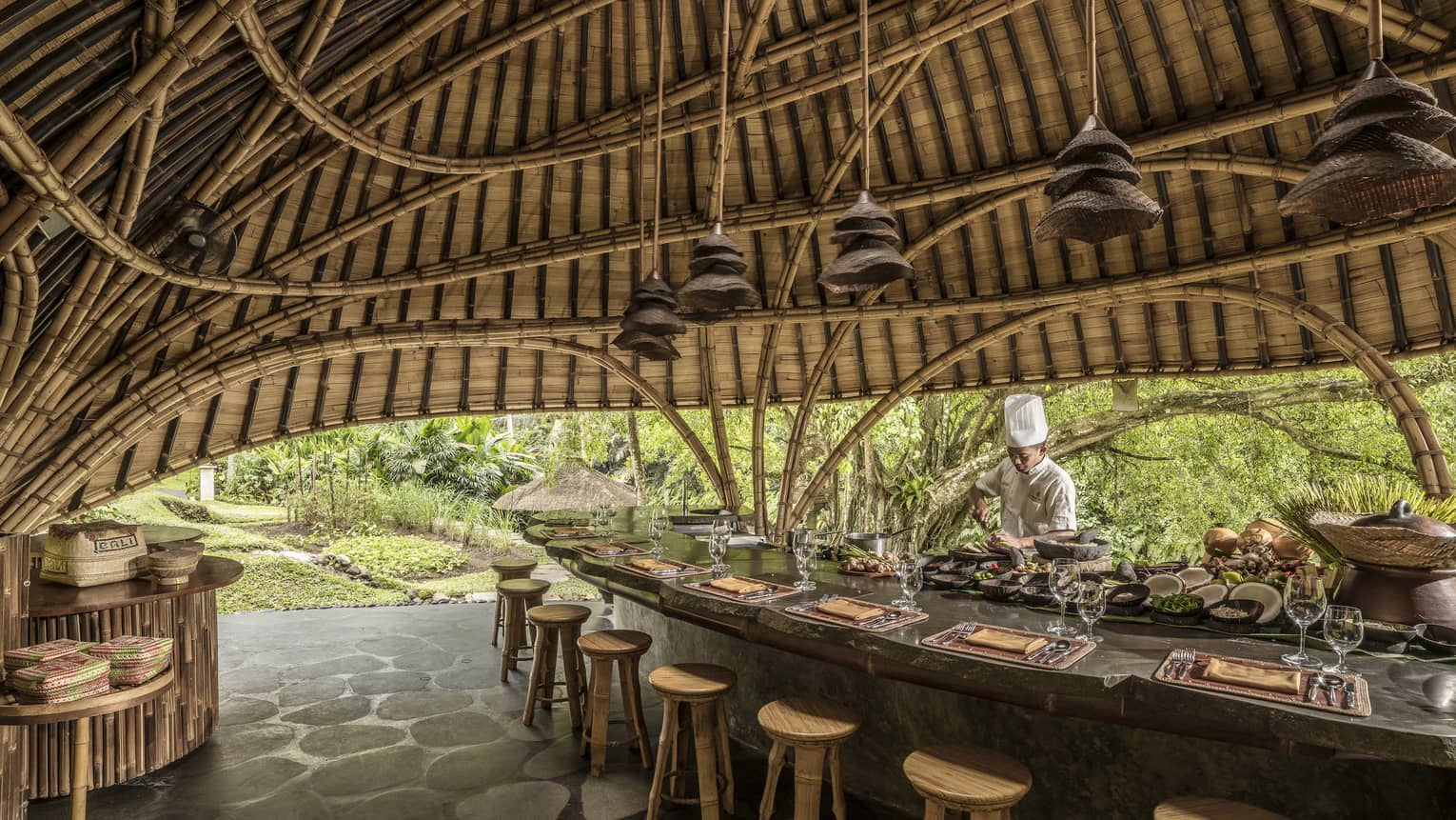 A chef prepares for Sokasi Cooking School in a bamboo pavillion