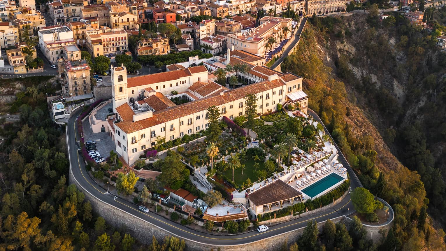 An Aerial view of a large property on a hill or cliffside.