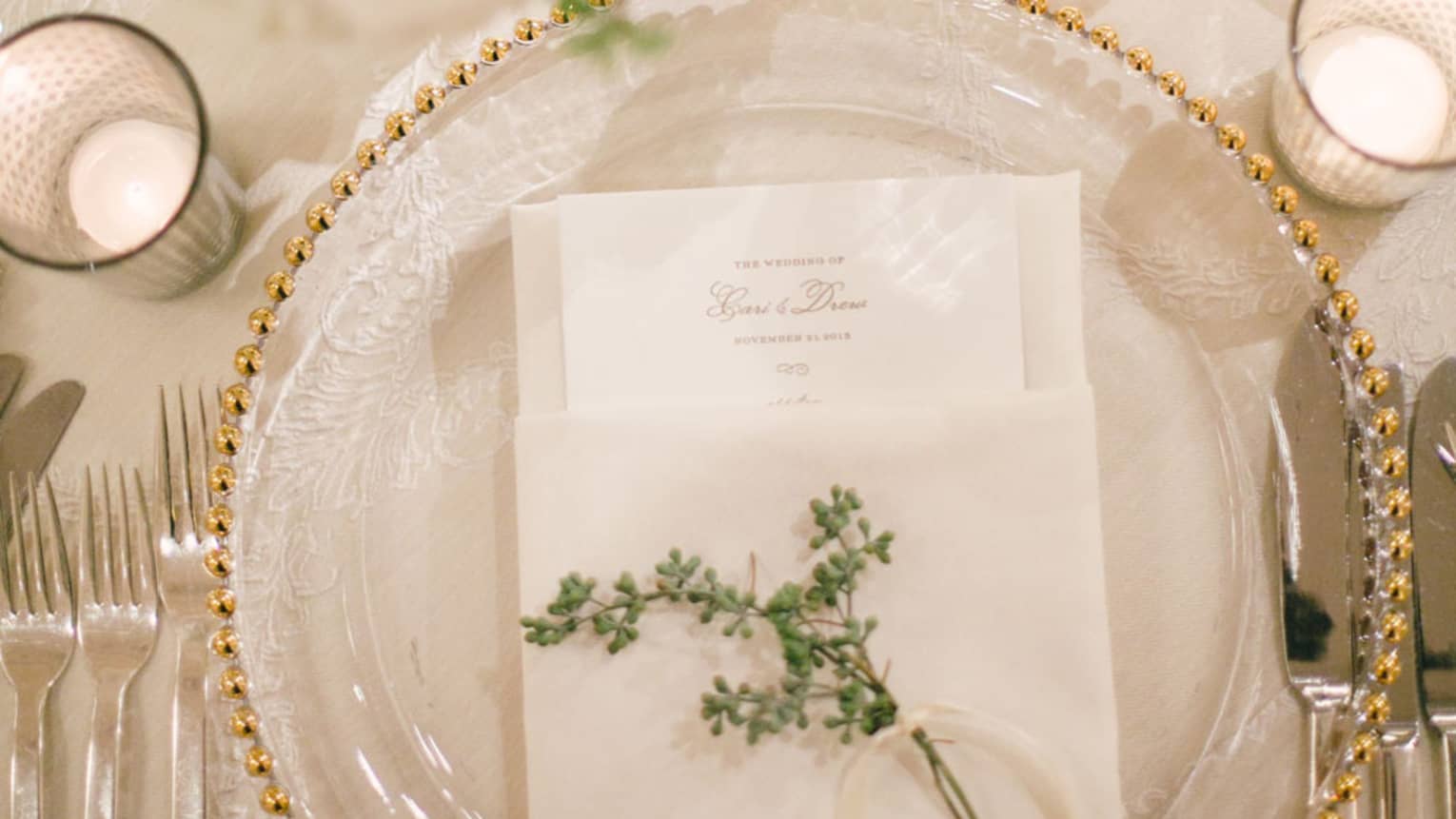 Wedding table setting with menu and flower on plate