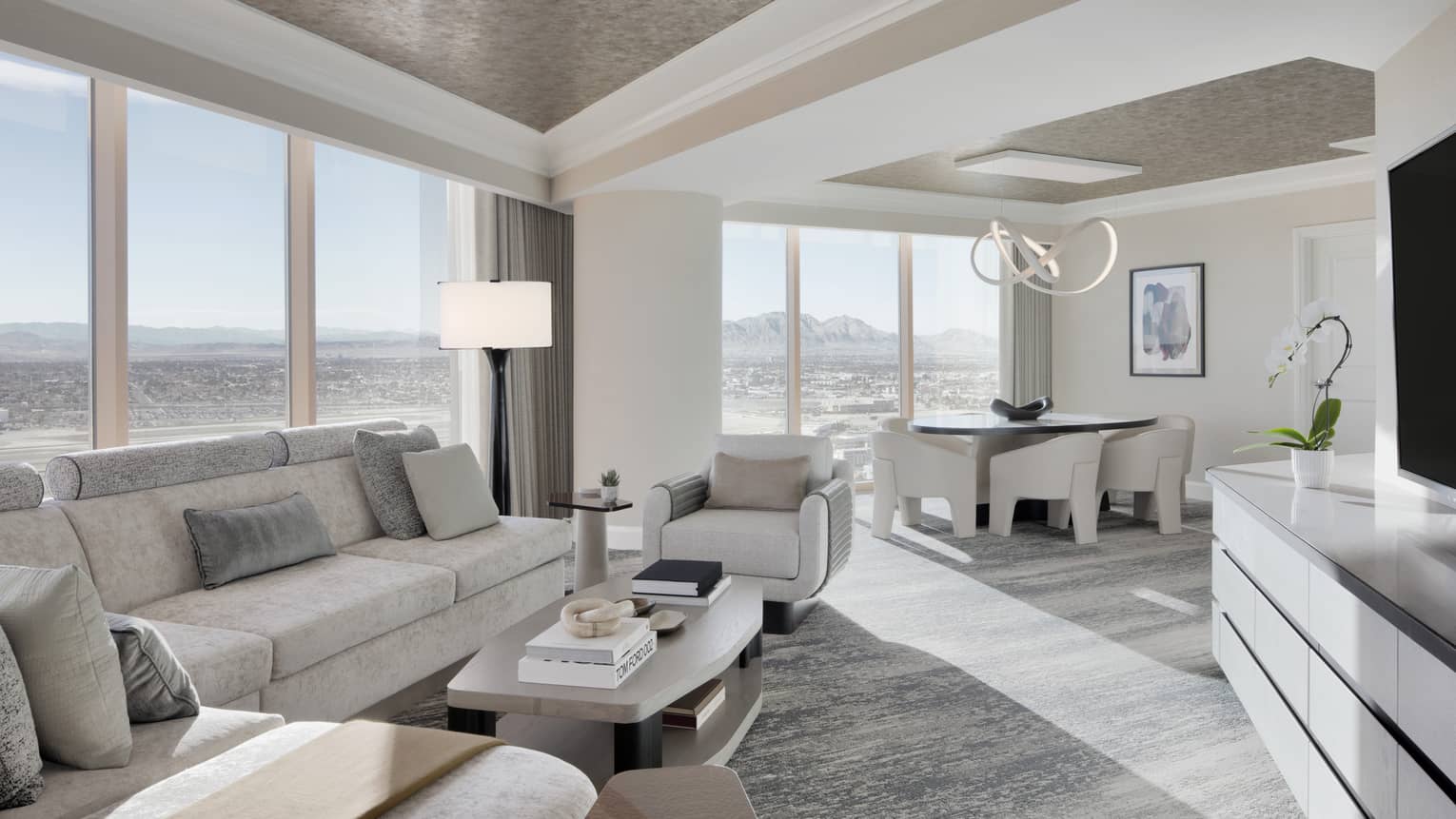 Light-filled living room and dining room of Sunrise Panoramic Suite at Four Seasons Hotel Las Vegas