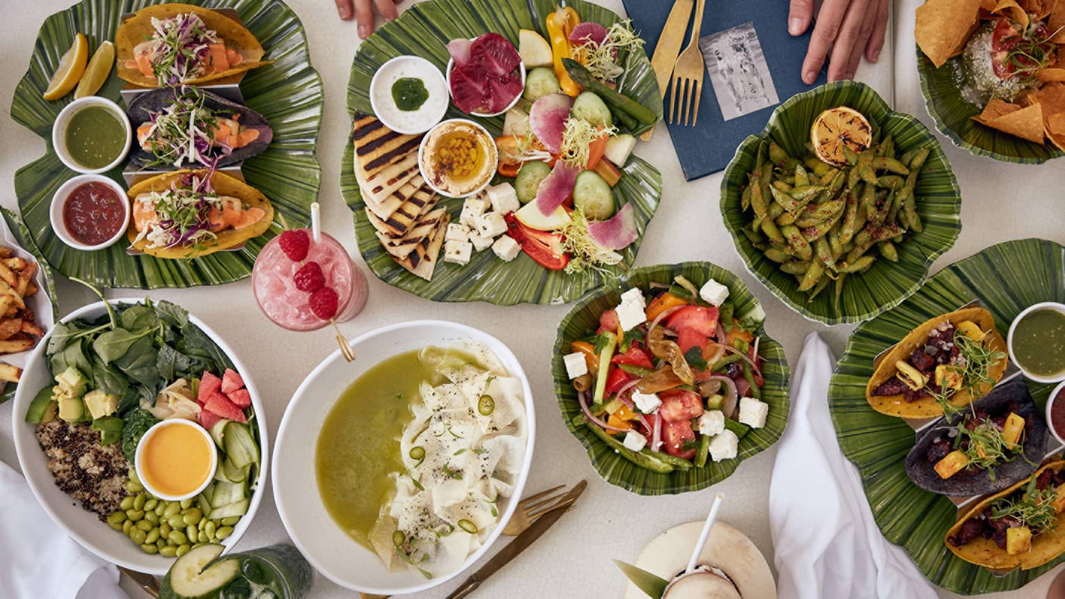 Smorgasbord of tropical dishes artfully displayed on green ceramic plates served at one of the Surfside restaurants of note at Four Seasons Surf Club, Florida.