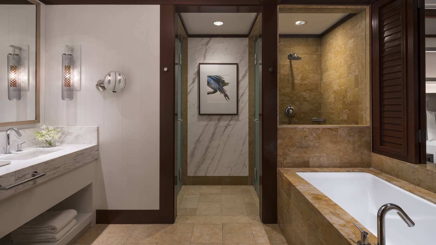 Bathroom Interior Featuring Bathtub, Shower, Sinks, and Interior Hallway