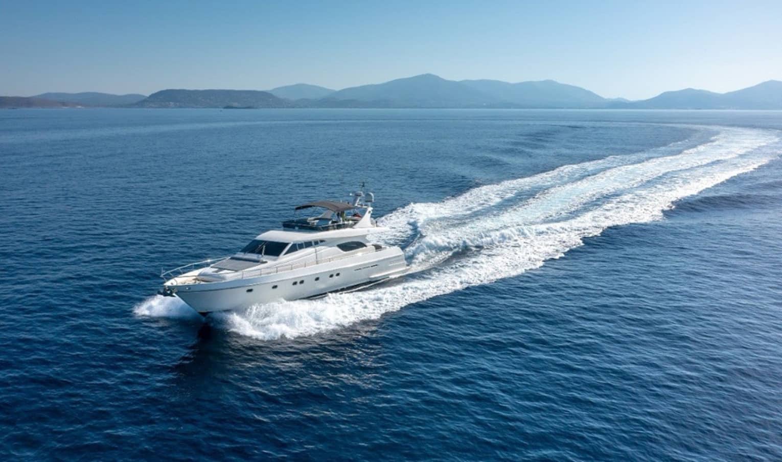 Yacht cruising crystal-blue waters