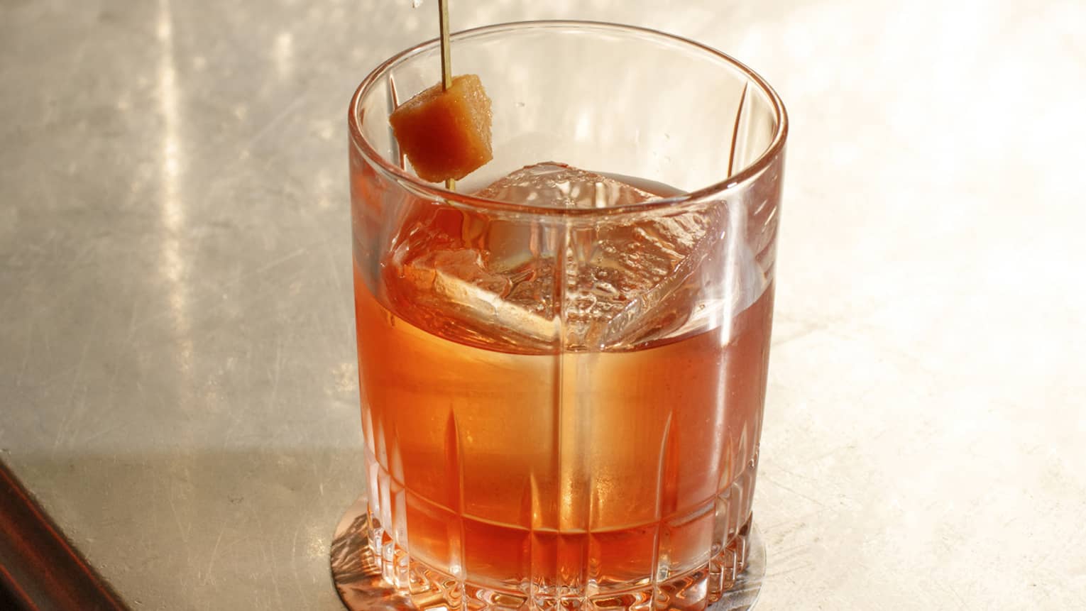 Negroni with quince and cheese in a rocks glass