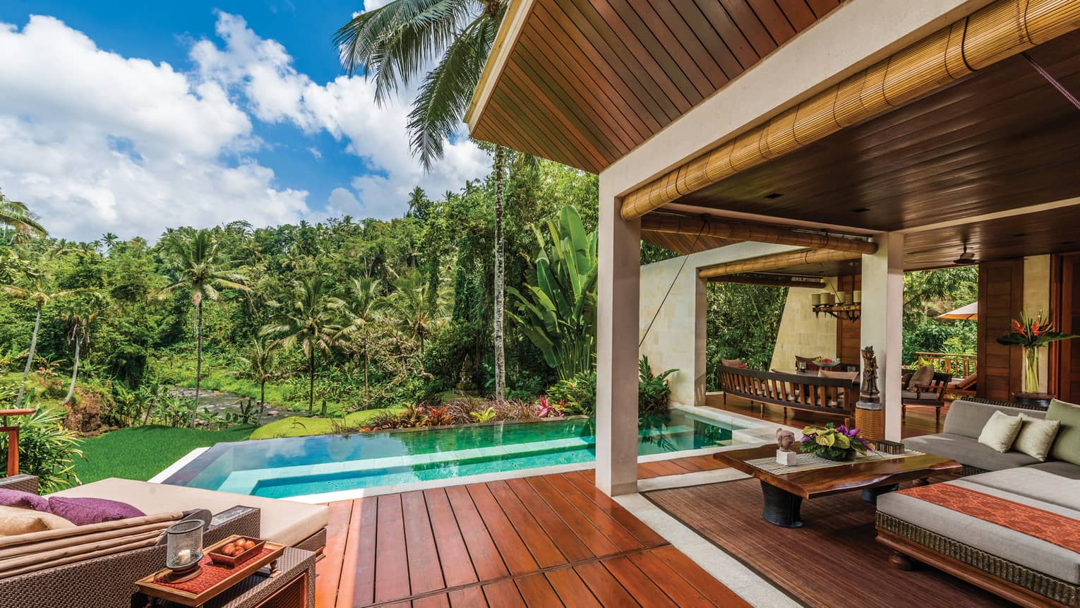 River-View Two Bedroom Villa patio with wood deck, blue plunge pool, large patio sofas with cushions, forest views