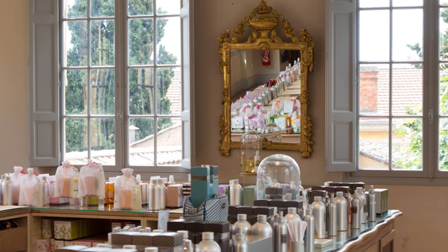 Fragonard parfumerie with fragrance bottles lining table