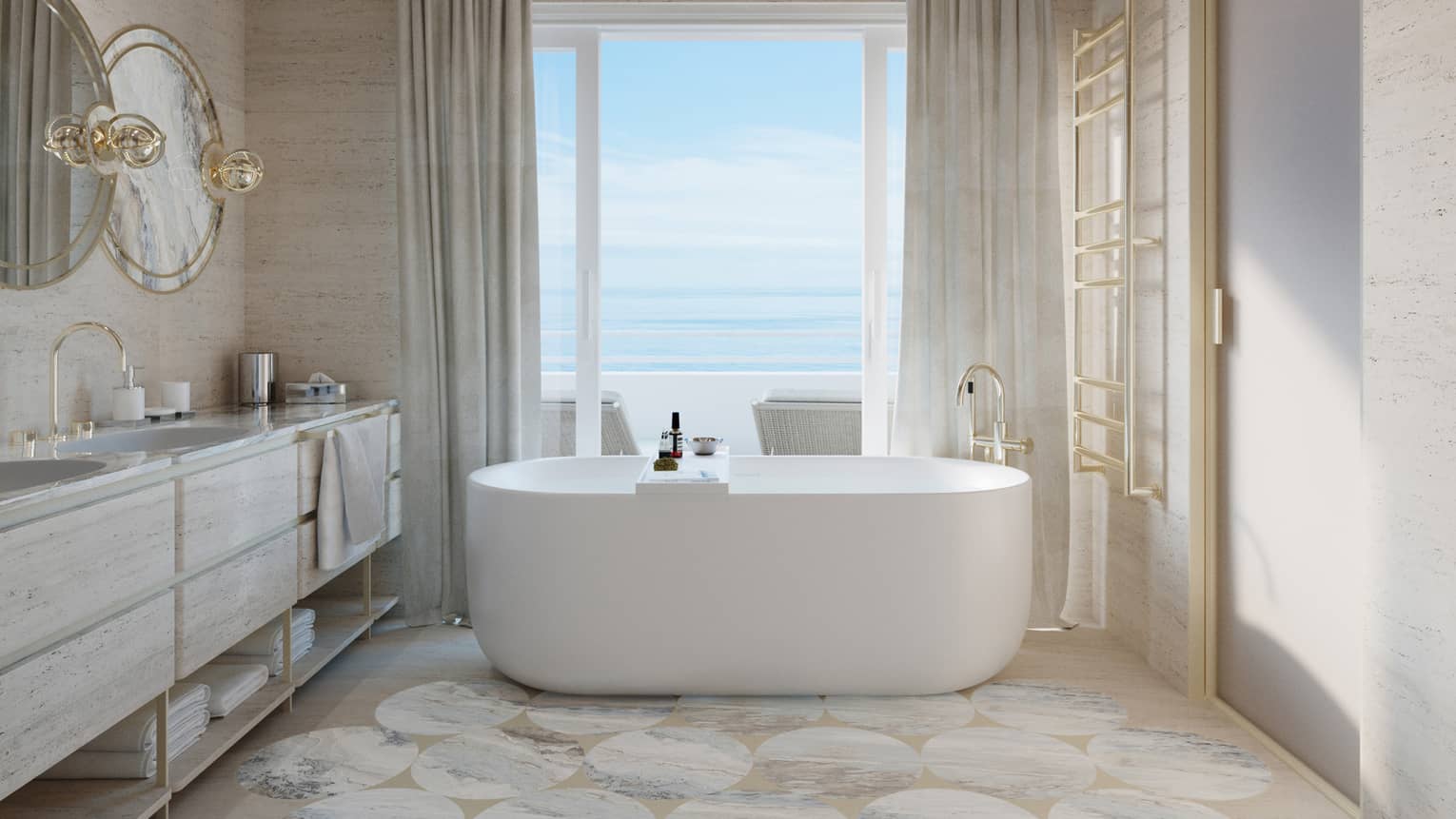 Grand bathroom with chandelier and freestanding tub by the window looking out to the sea