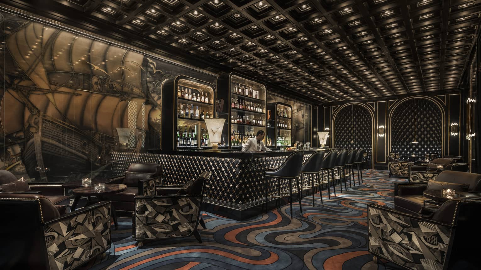 Nautilus Bar with blue-and-orange ocean-like swirled carpet, ship mural on wall, bartender behind bar