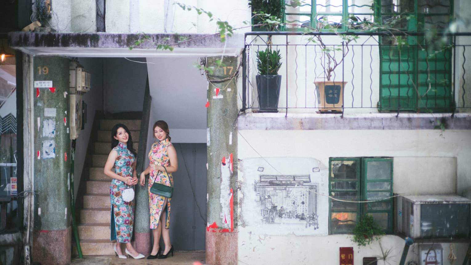 2 ladies in Qipao discovering Central district in Hong Kong via Four Seasons Hotel Hong Kong's local unique experience tour.