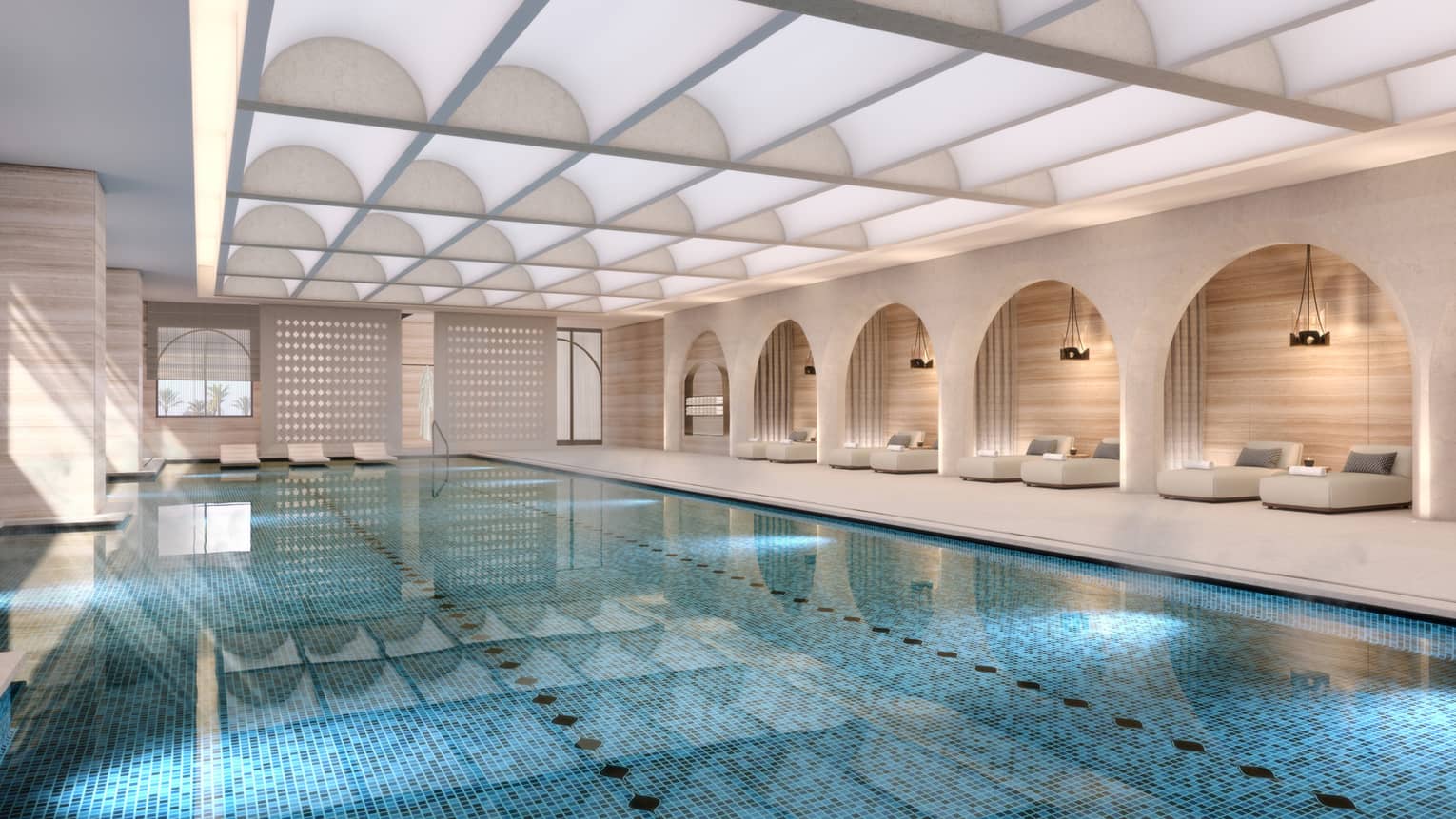 Indoor pool with daybeds along the wall