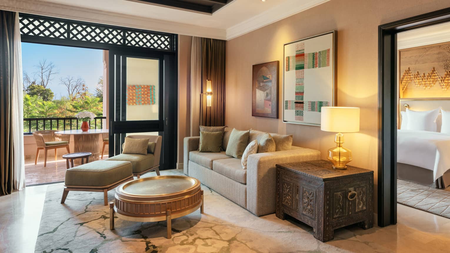 Marrakech hotel suite with living room and separate bedroom, pool view terrace