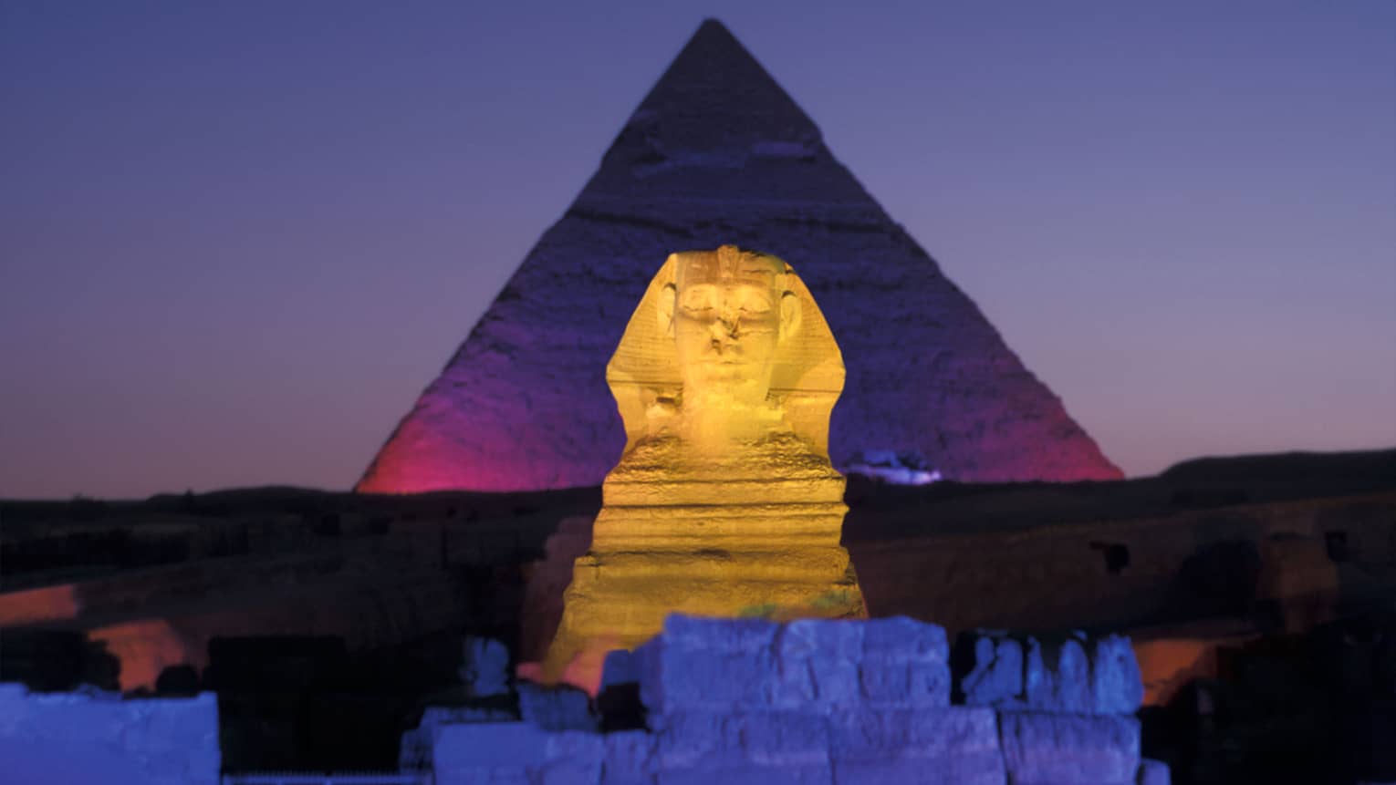 Night view of Pyramids of Giza and Great Sphinx illuminated