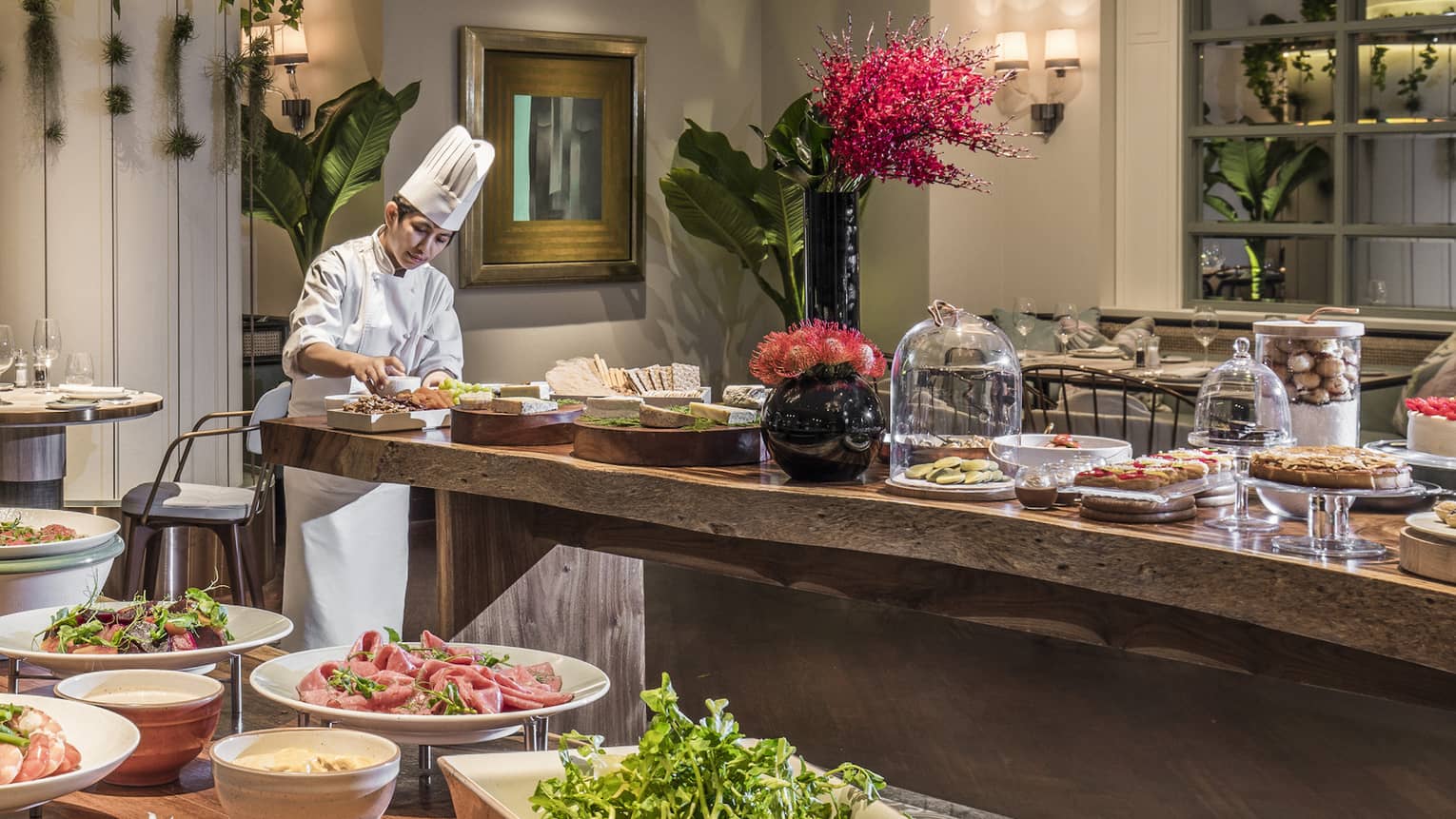 A lunch buffet arranged with platters of seafood, fresh vegetables and a large variety of other options at the One Ninety Restaurant