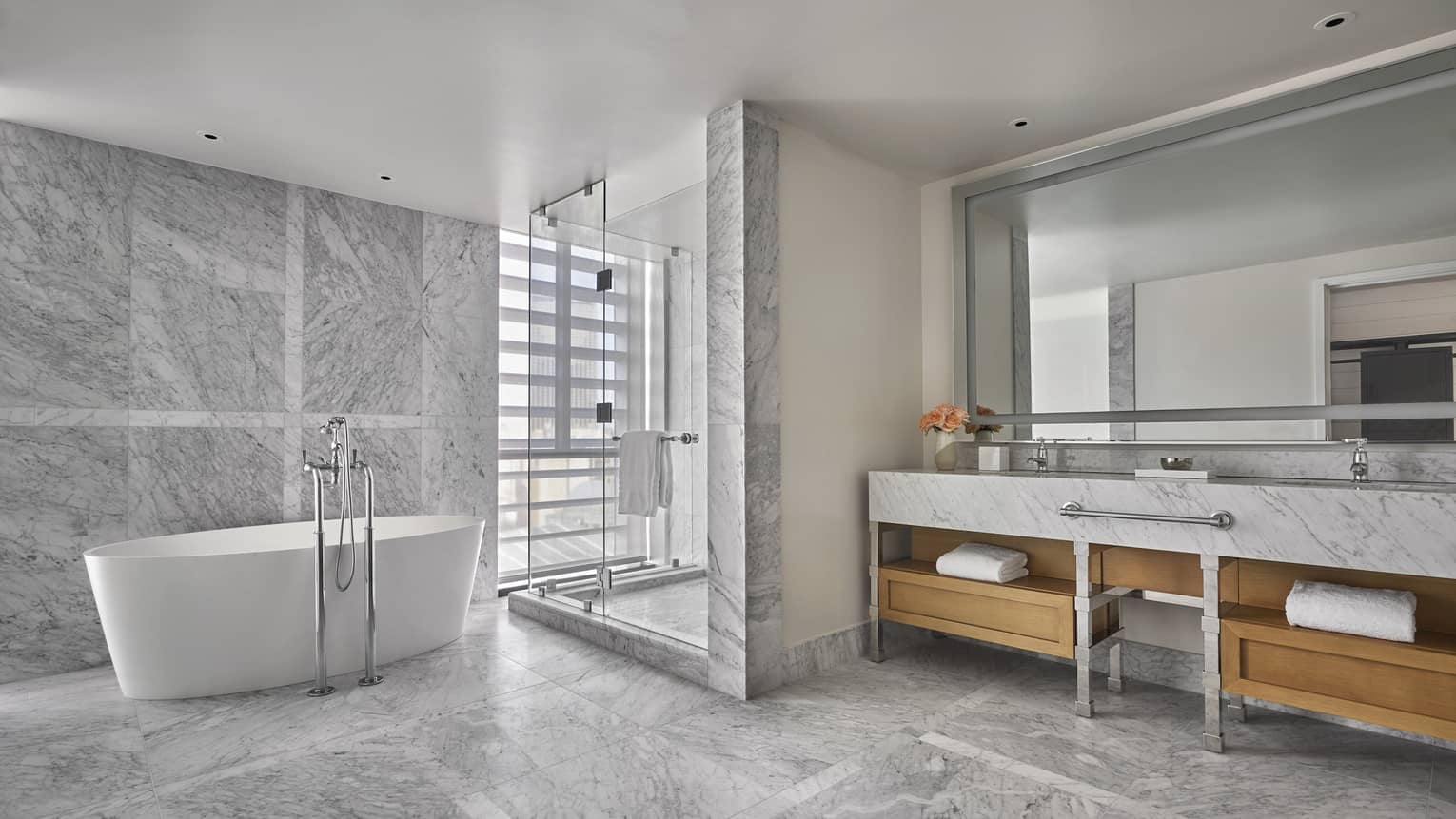 Marble bathroom with shower and freestanding tub
