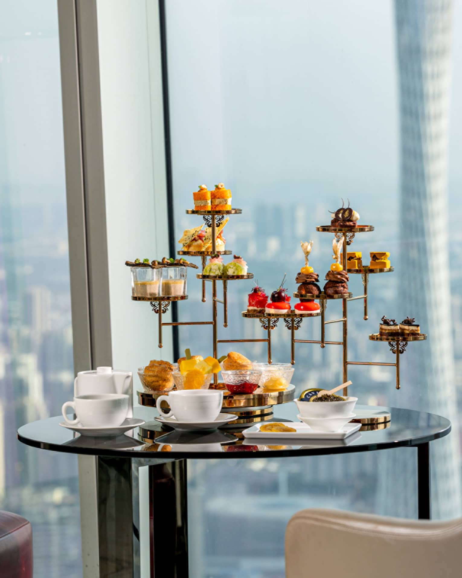 Afternoon Tea sweets tower at the Atrium with views of downtown Guangzhou