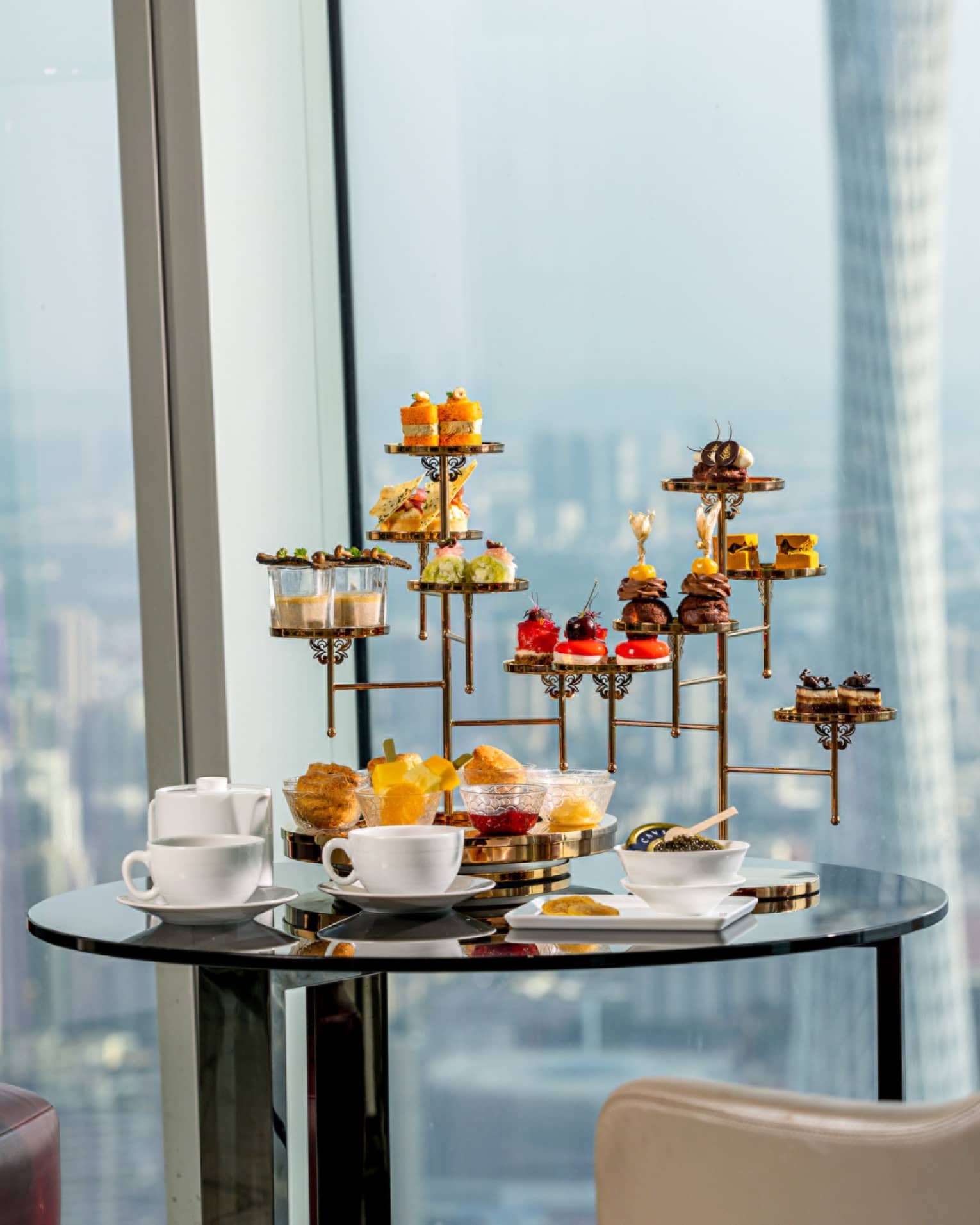 Afternoon Tea sweets tower at the Atrium with views of downtown Guangzhou
