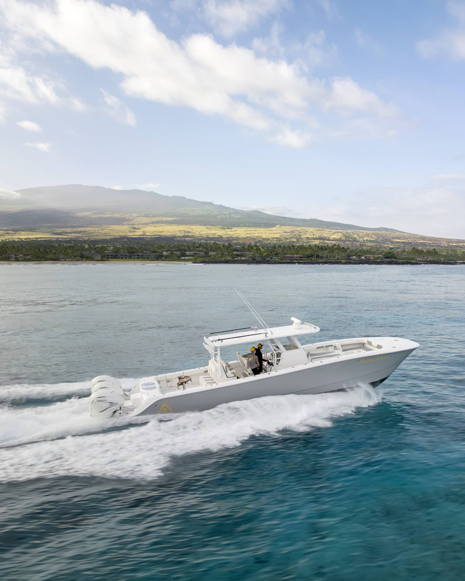 Boat on the water along Hawaii Island coast