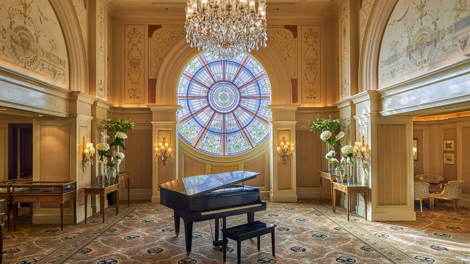 Piano in the Tea Lounge with stained-glass window, the Ocular, in background