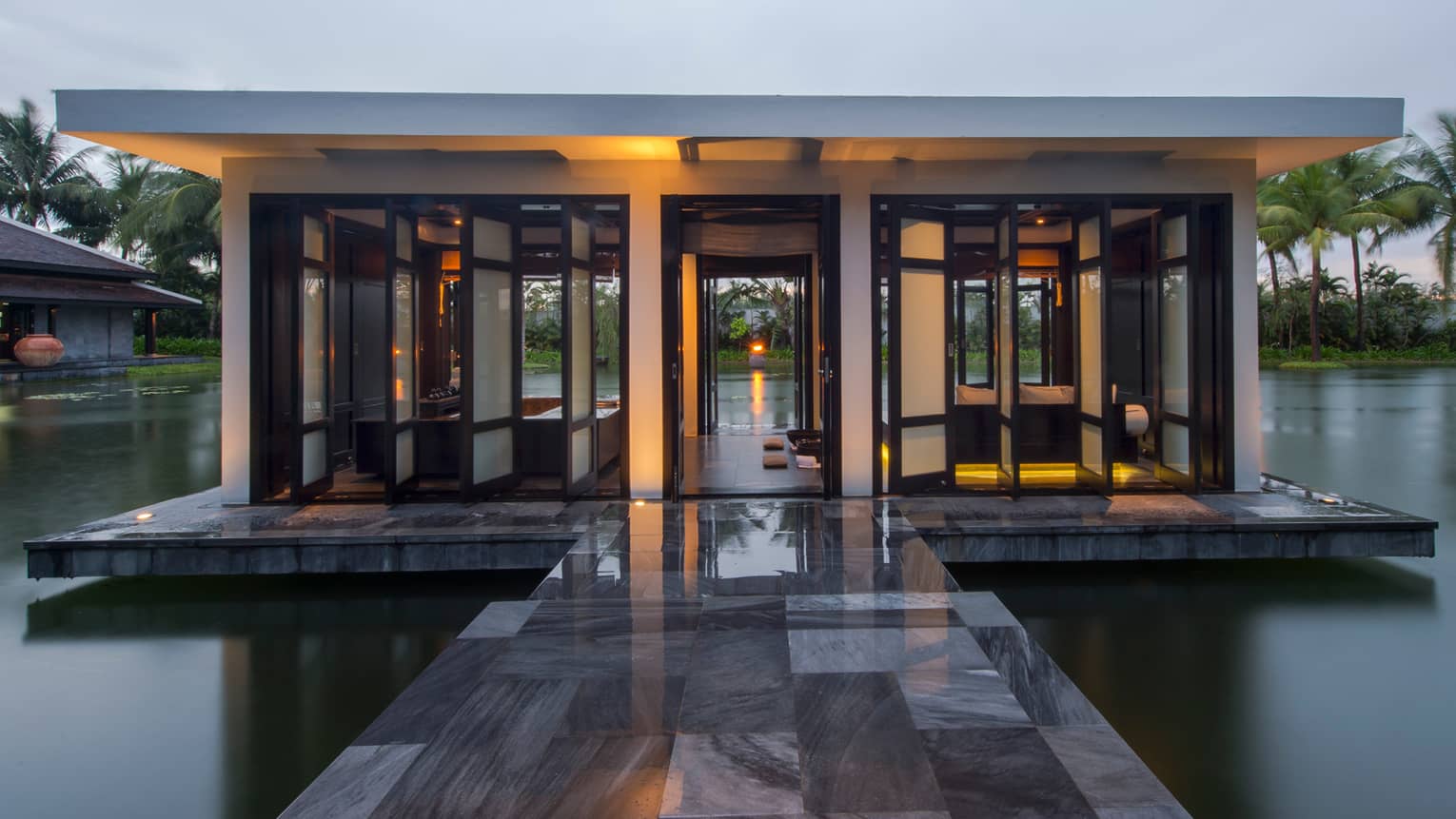 Marble tiles over lotus pond to The Heart of the Earth spa 