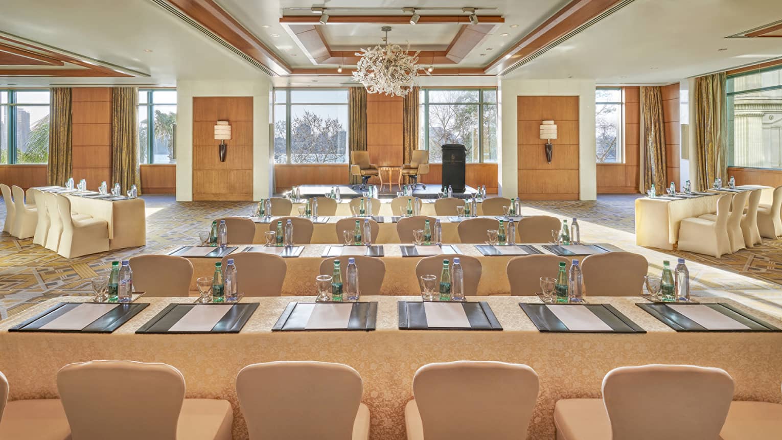 Bright Nile Ballroom with rows of conference meeting tables and chairs 