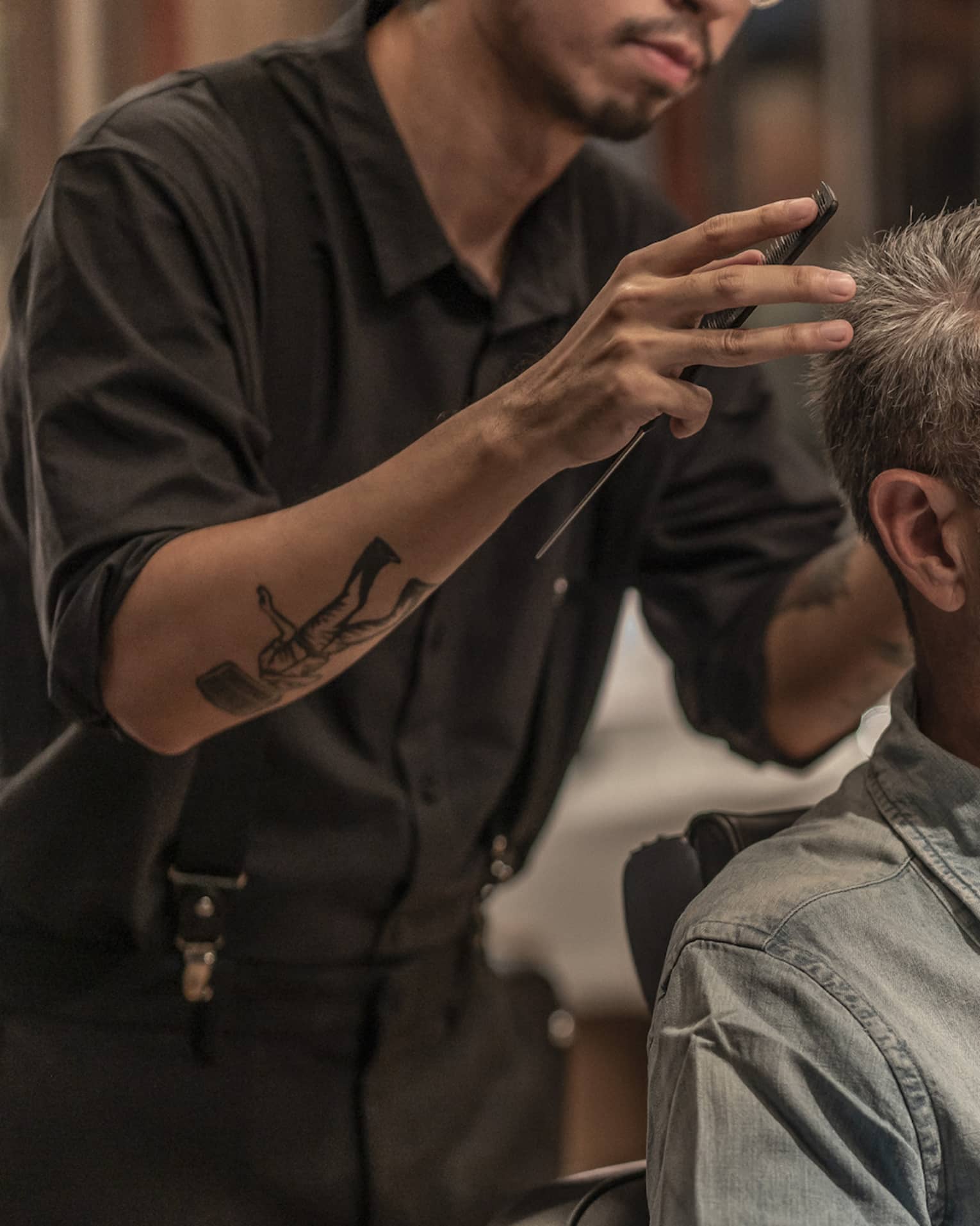 Man receives haircut in the Spa's barbershop