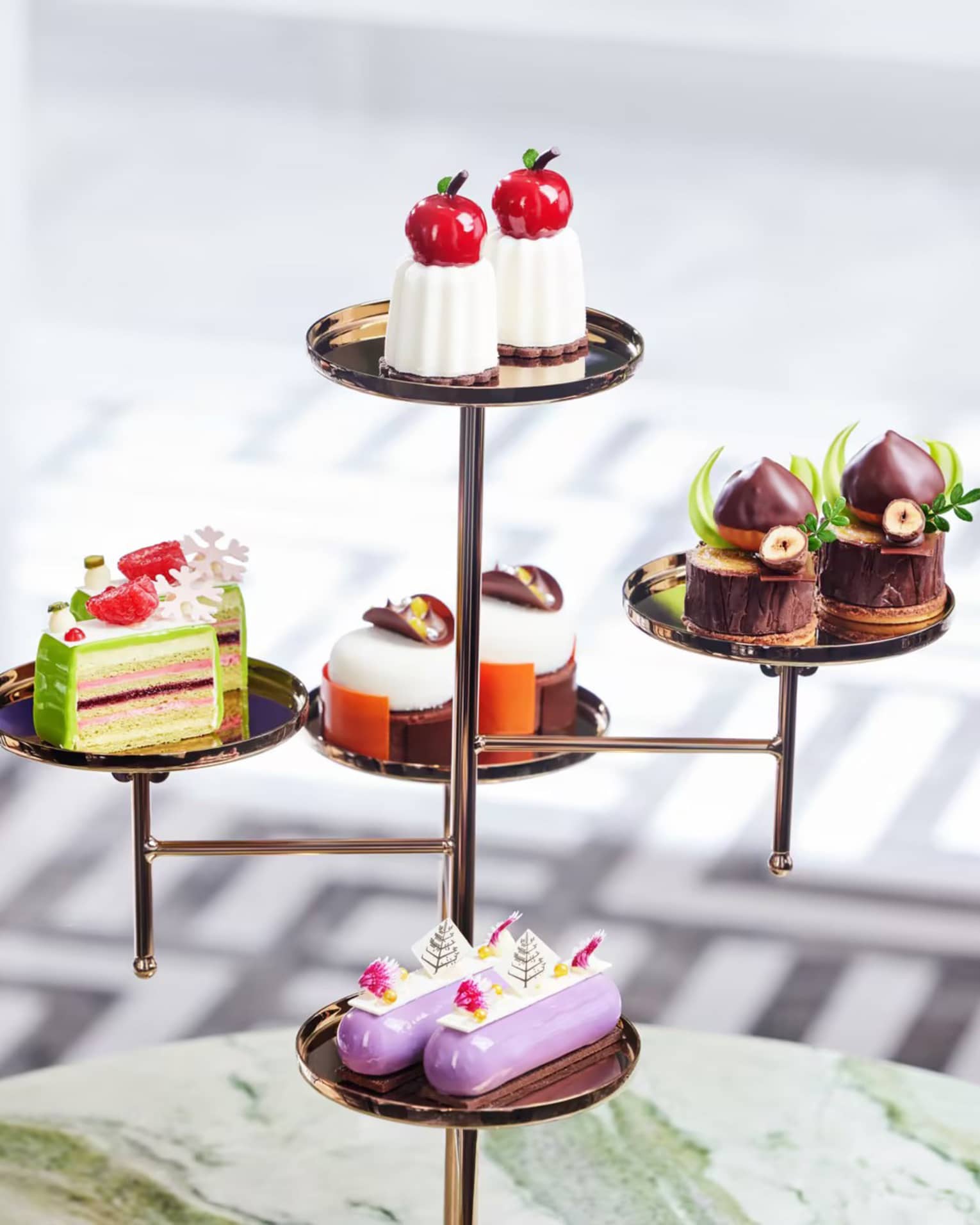 Afternoon tea mini pastries and cakes on a tiered platter
