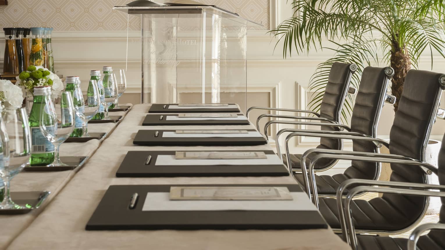 Phipps Room elegant boardroom meeting table lined with black executive chairs