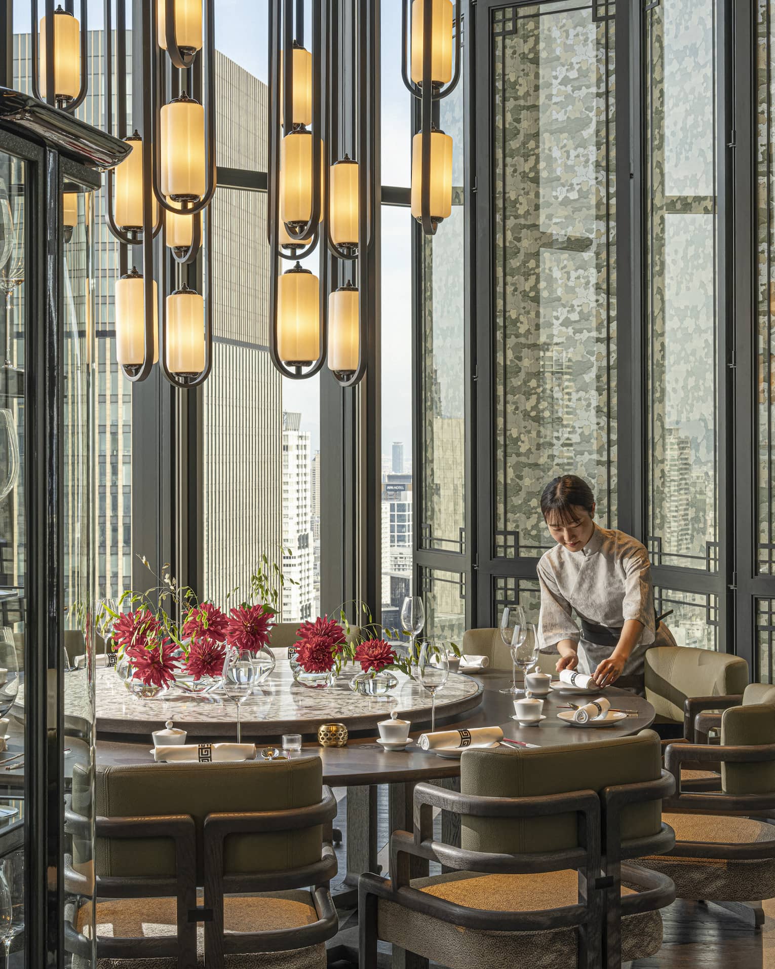 Light-filled dining area inside Jiang Nan Chun restaurant at Four Seasons Hotel Osaka