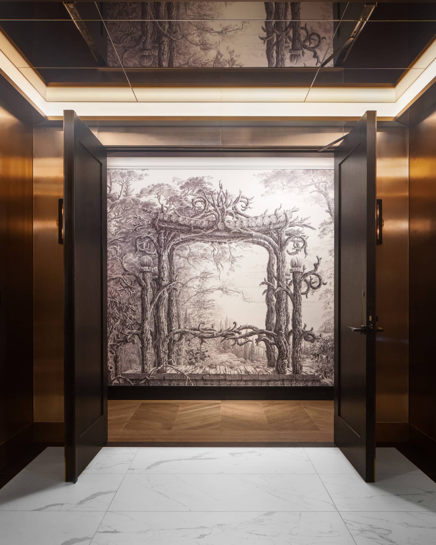 Interior wood-panelled hallway with two doors opening up to reveal a black-and-white painting