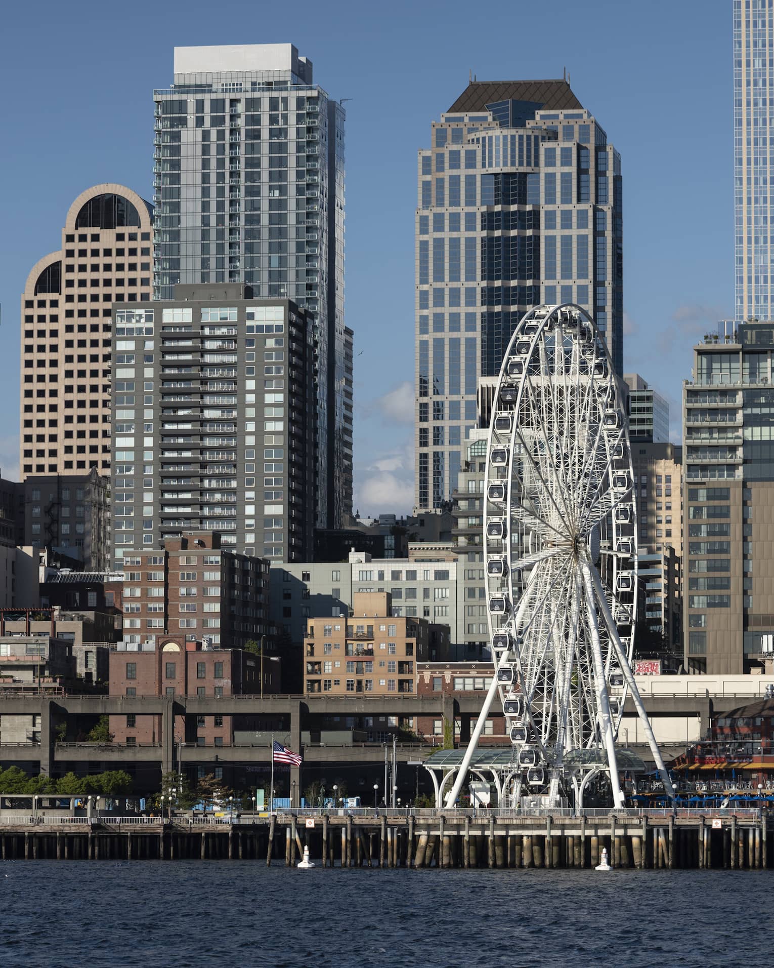 The Seattle Great Wheel stands out among skyscrapers on Elliott Bay