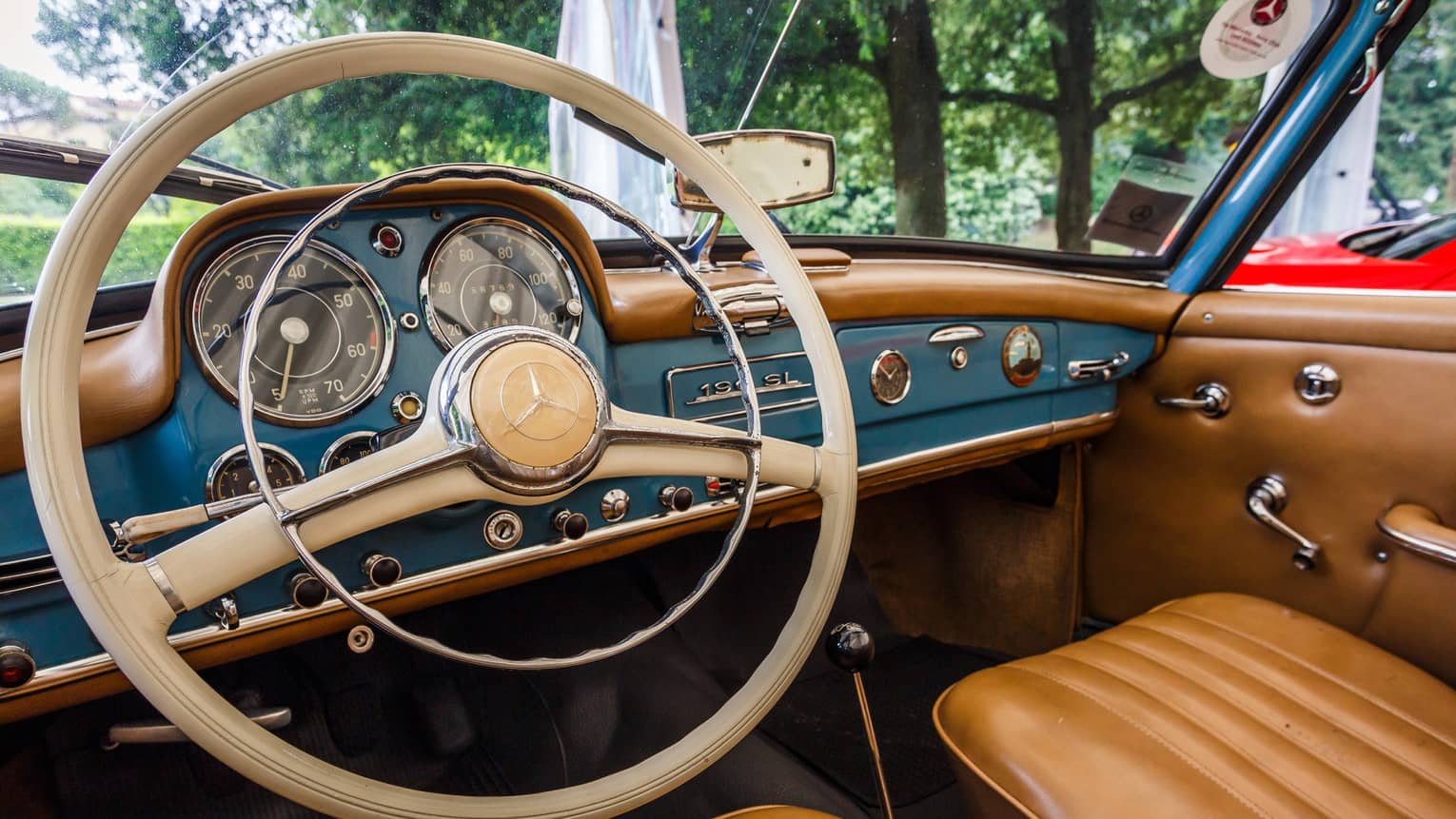 Wheel, dashboard, leather seats of classic luxury car