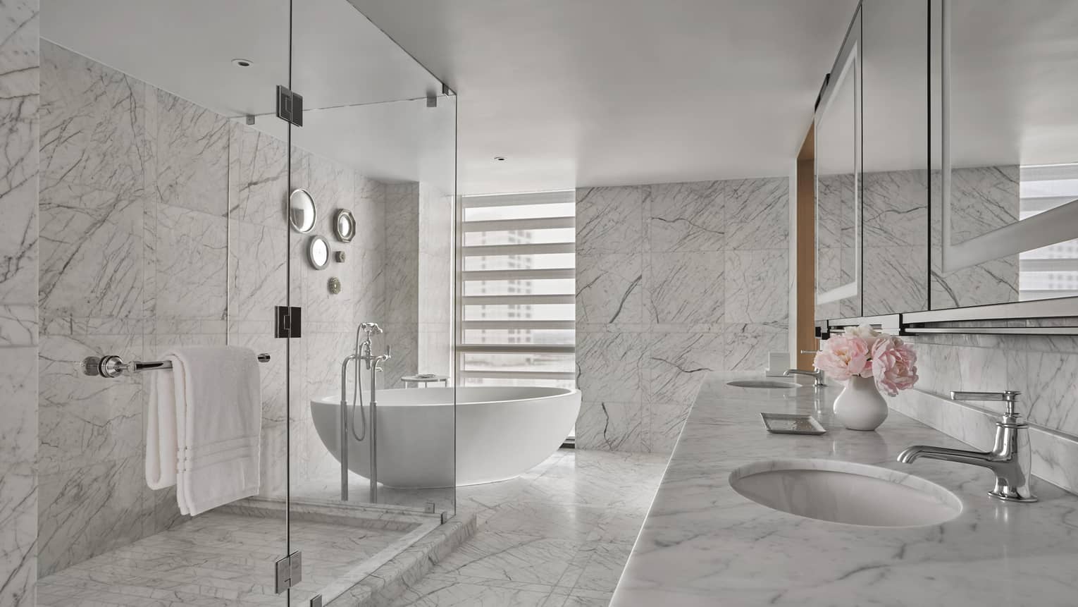 Marble bathroom with shower and free-standing tub