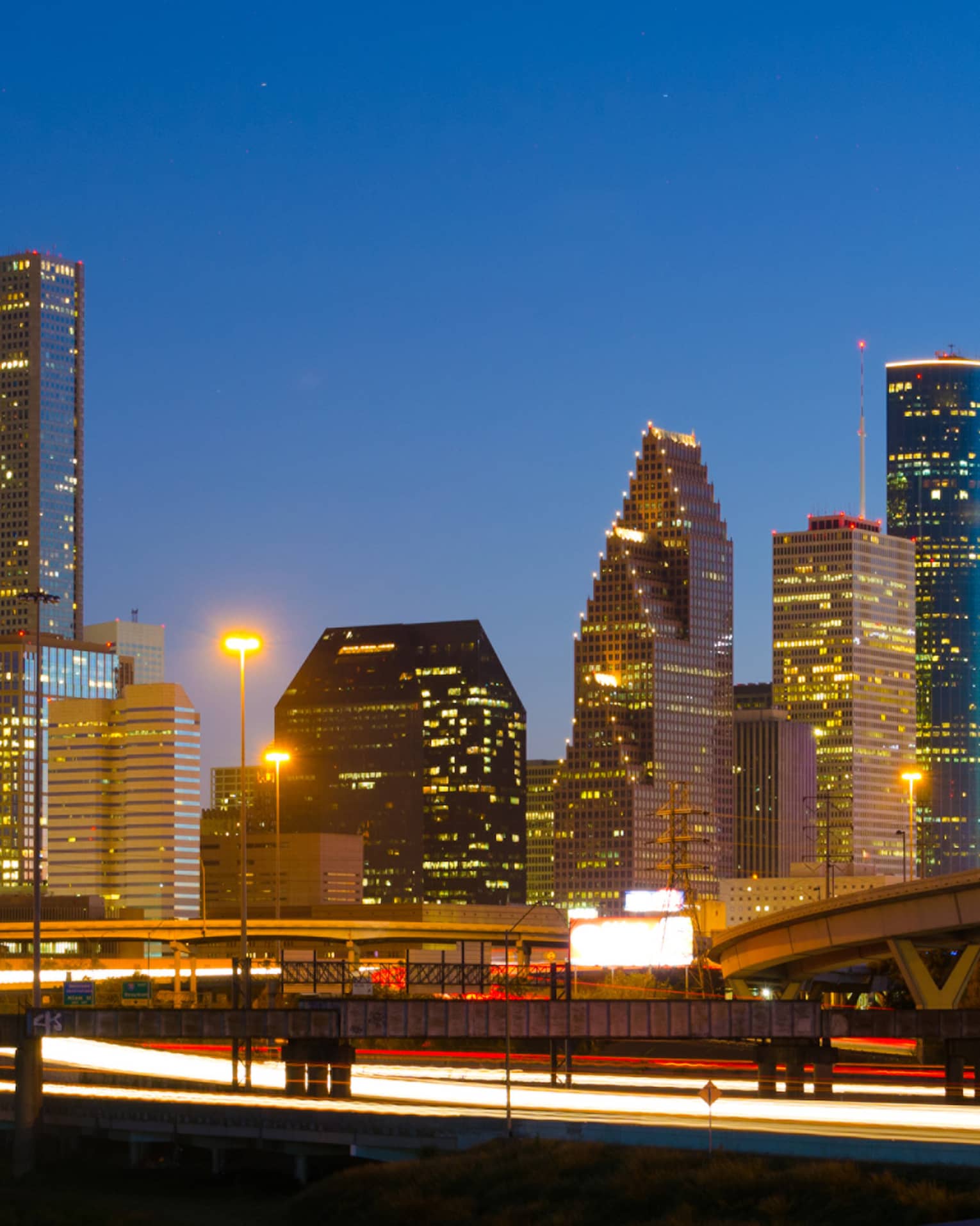 Houston city skyline, highway at night