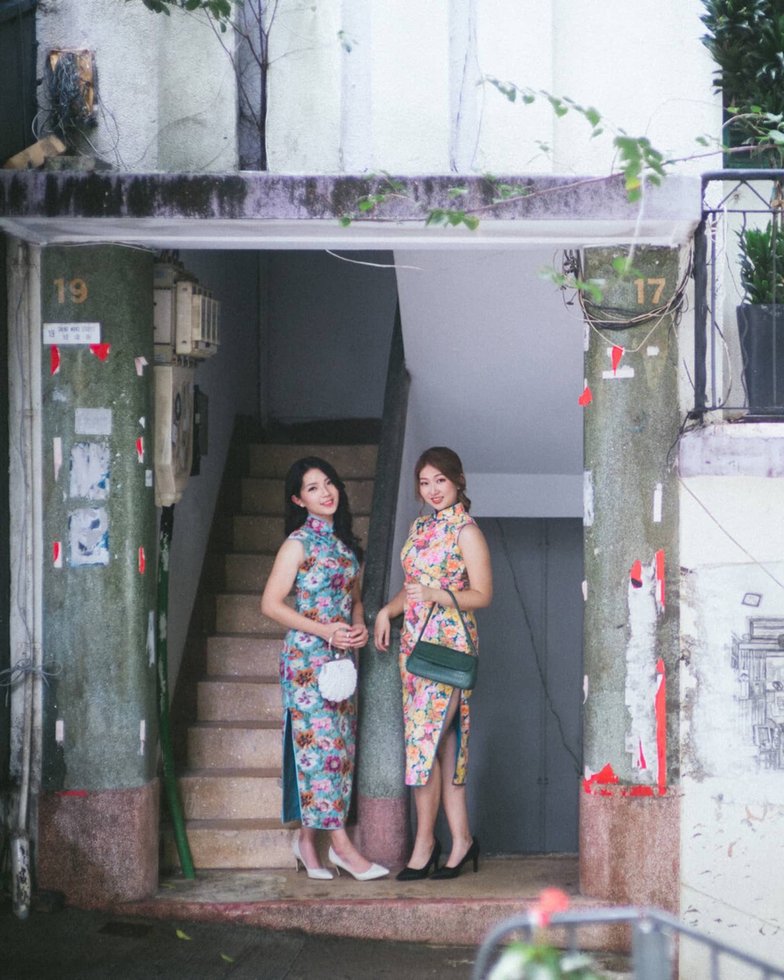 2 ladies in Qipao discovering Central district in Hong Kong via Four Seasons Hotel Hong Kong's local unique experience tour.