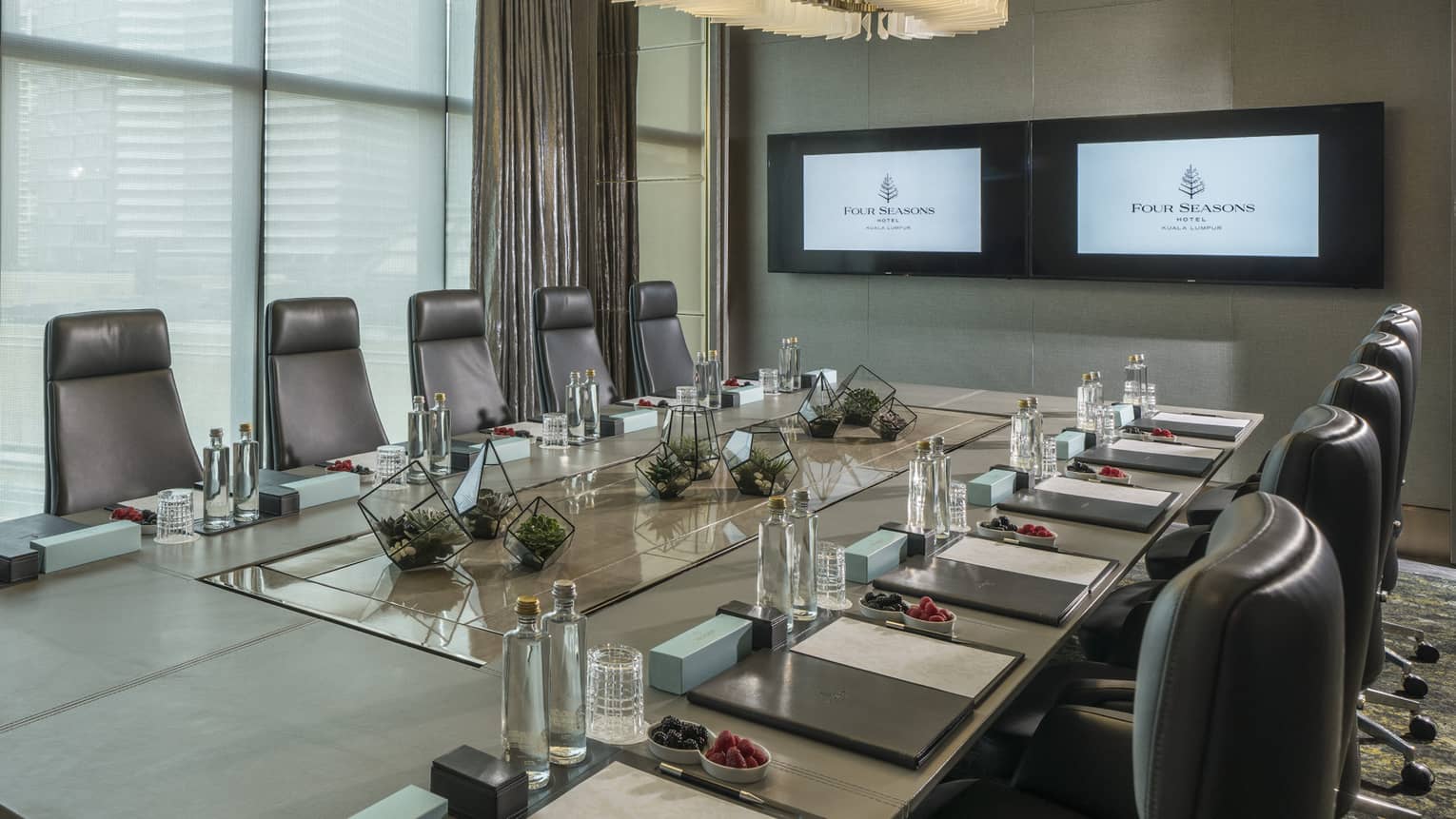 Private meeting room at Four Seasons Hotel Kuala Lumpur, featuring floor-to-ceiling windows