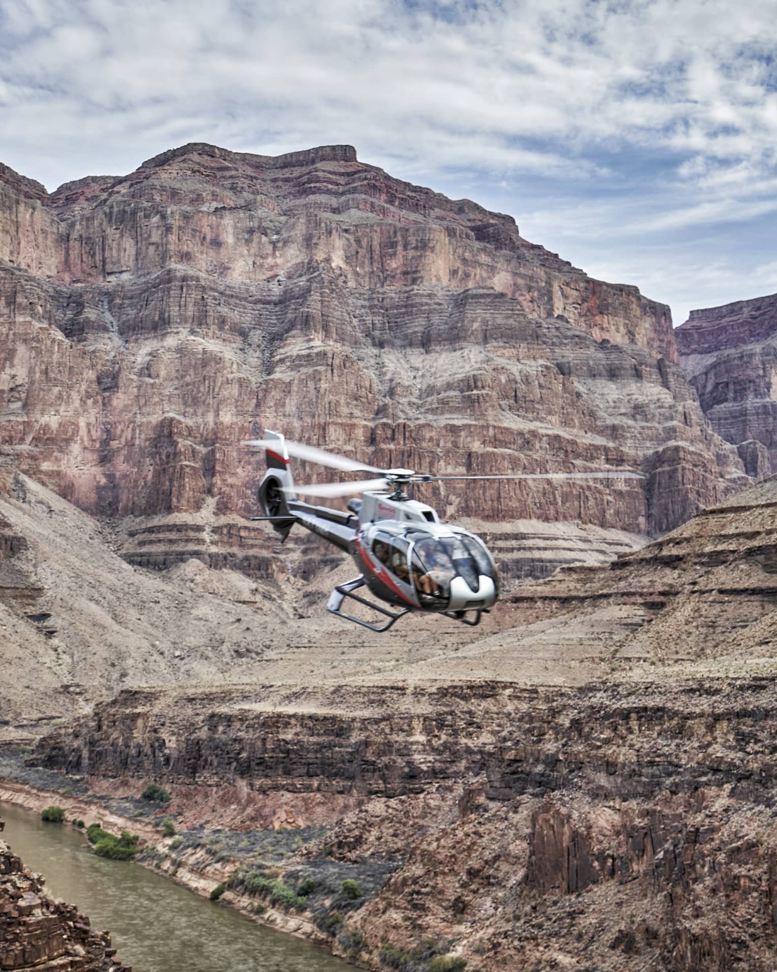 Helicopter flies over Grand Canyon
