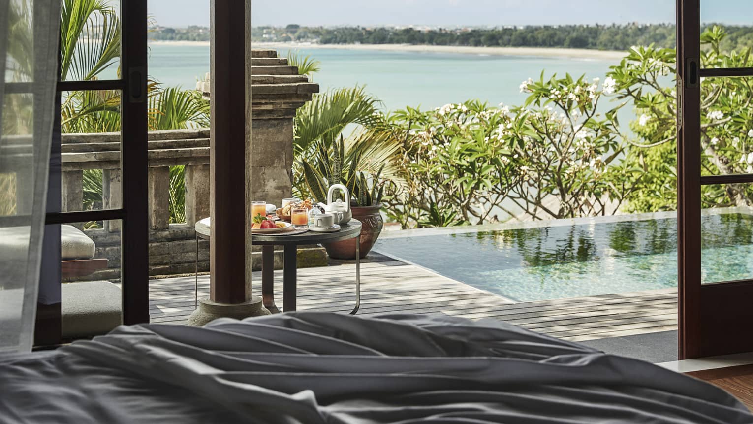 Private pool by villa and view of beach