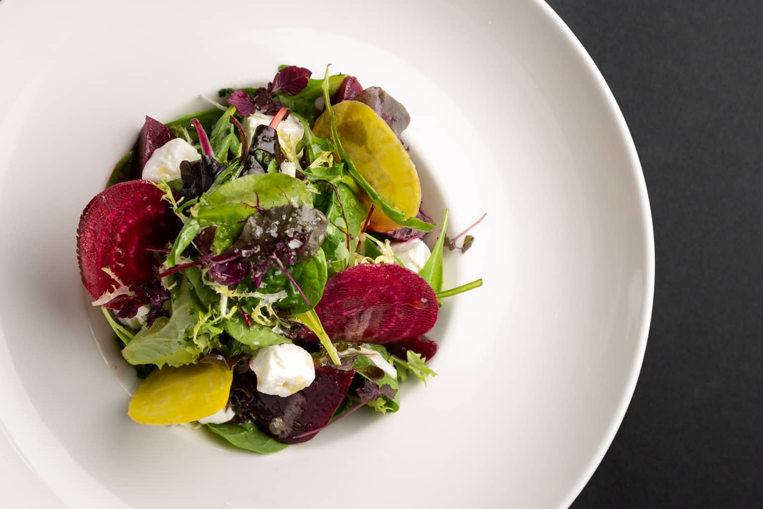 Red and gold beet salad with feta cheese, orange and pistachio