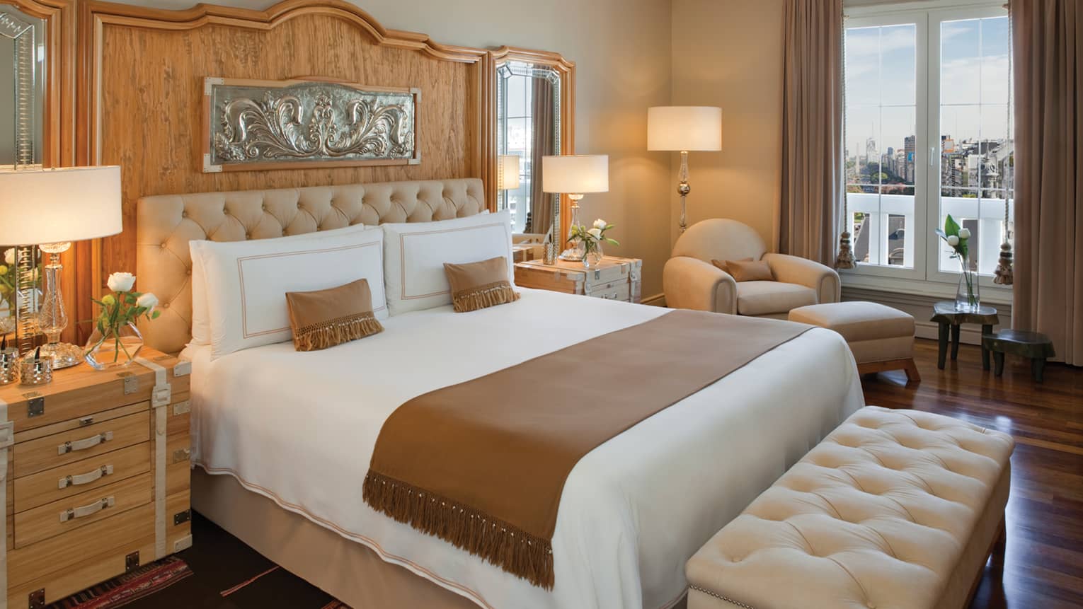 A large bed in the centre of a guest suite.