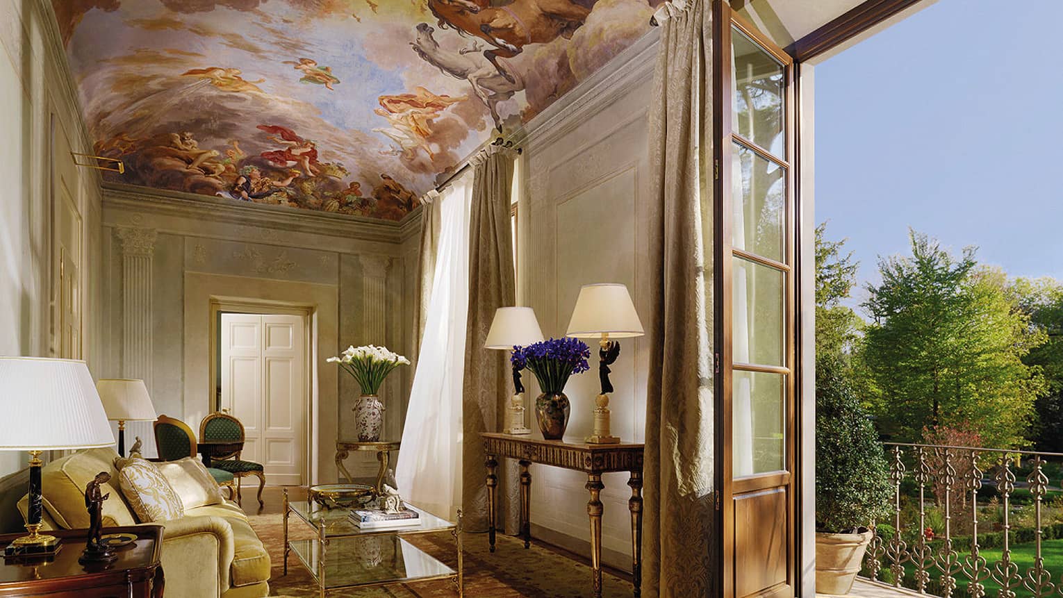 Presidential Suite sitting area under mural panel ceiling, open balcony door