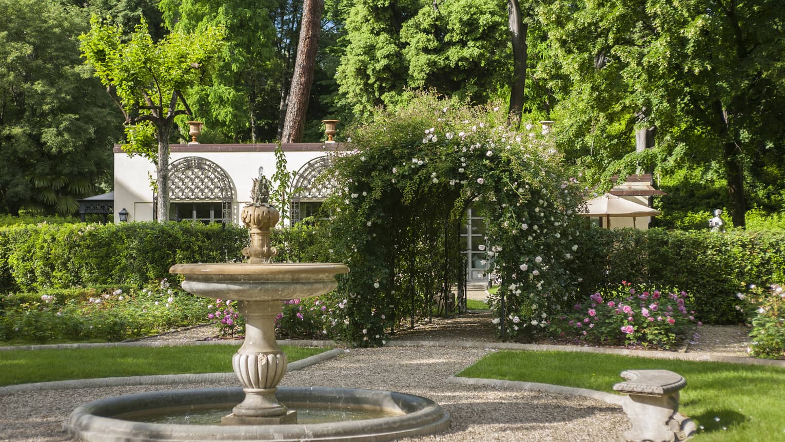 Stone fountain in sunny Garden Villa courtyard 