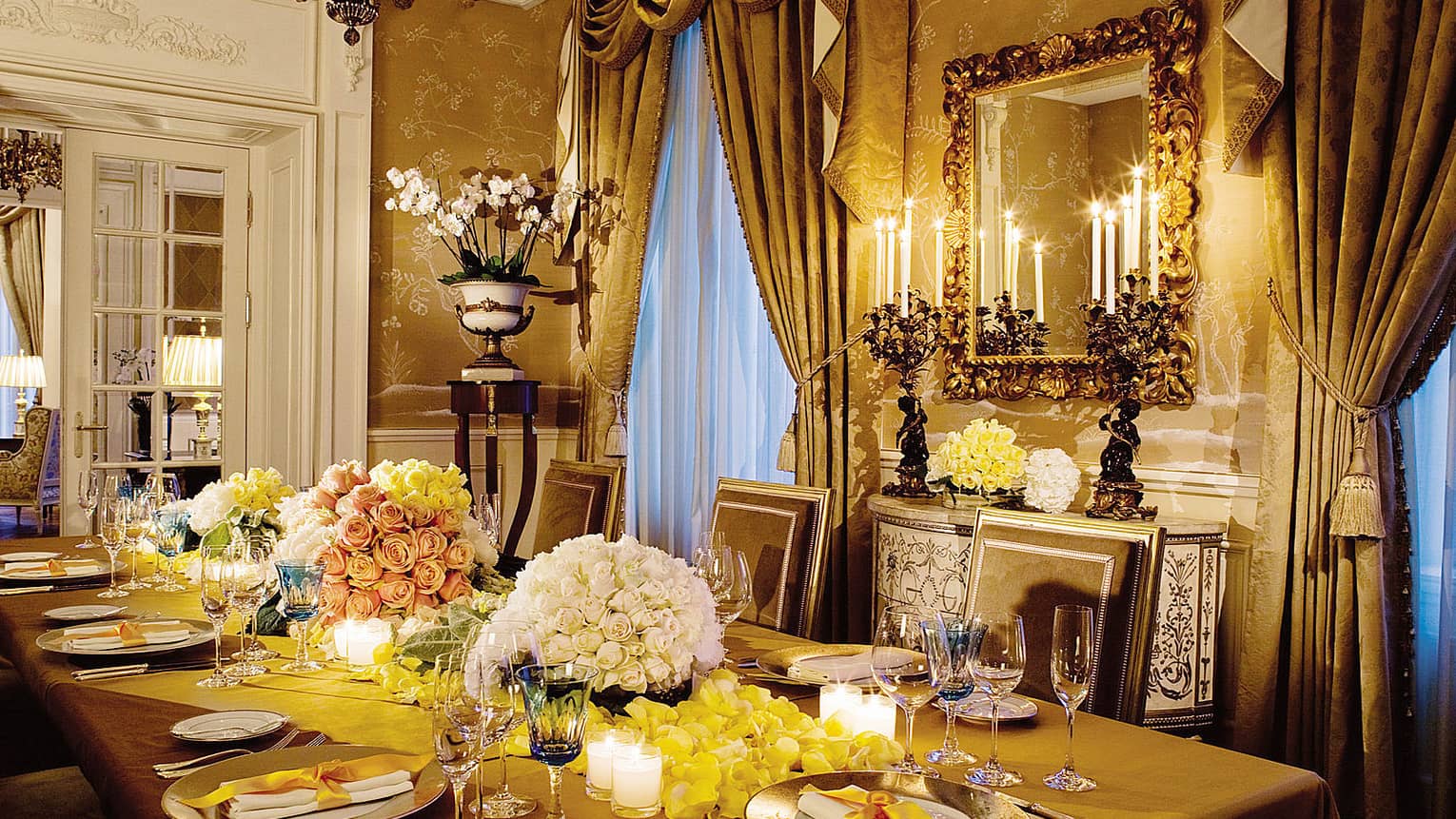 Royal Suite private dining table with glowing candles, flowers