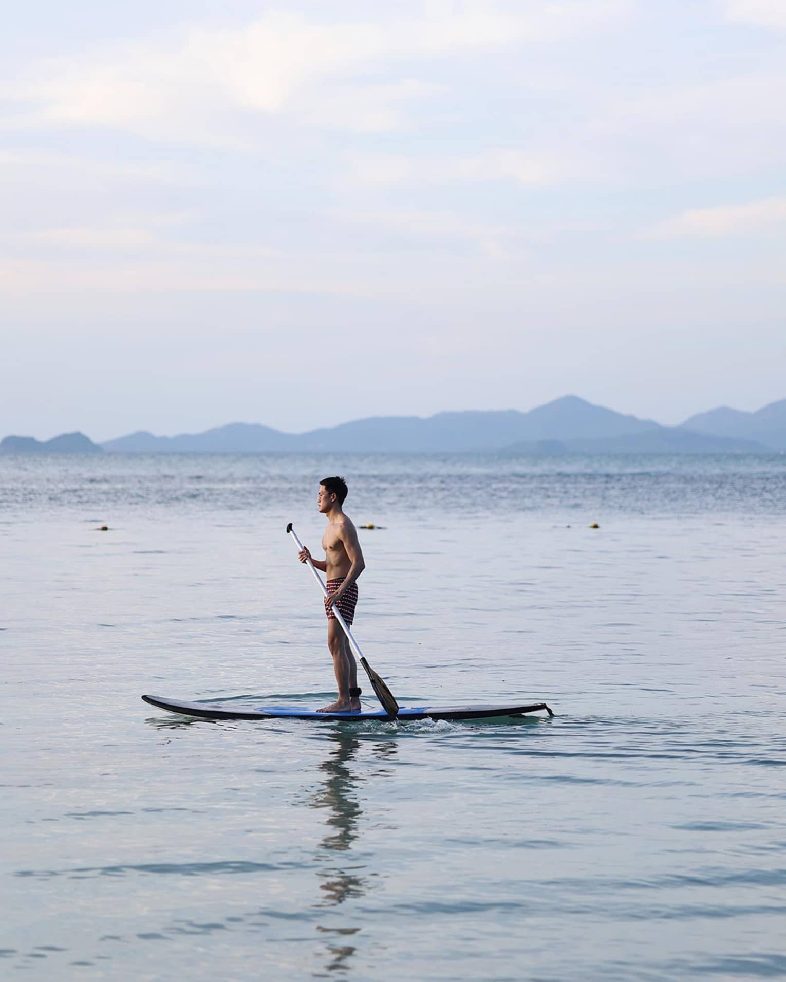 Man paddleboarding