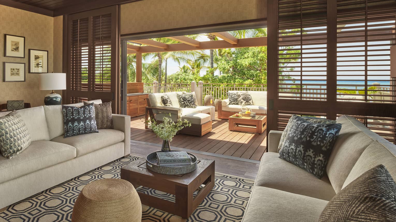 Living room with two sofas, coffee table, walk-out terrace