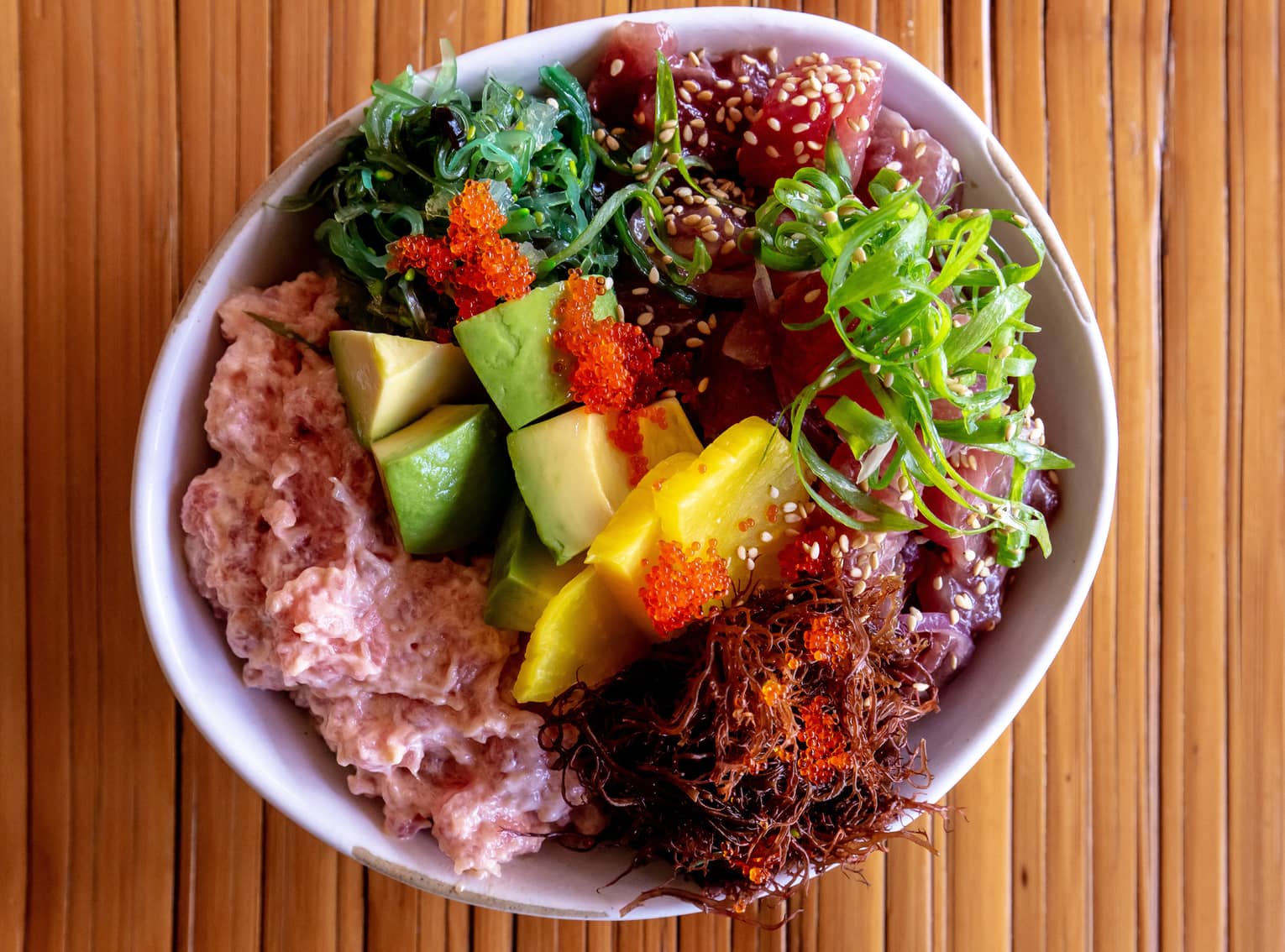 Poke bowl with avocado, mango and ahi tuna