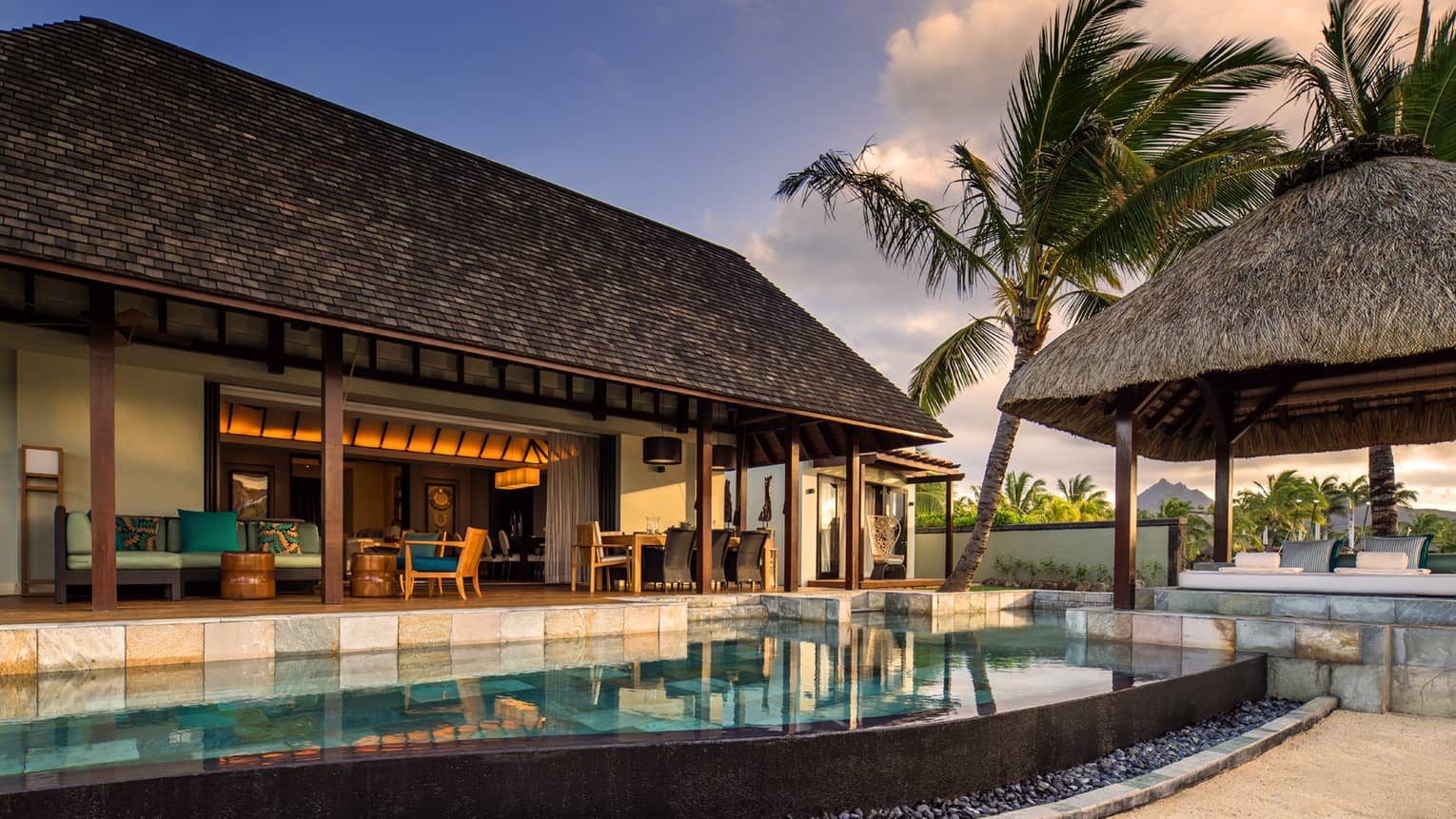 Private villa in tropical setting with private pool, terrace and thatched-roof pavilion