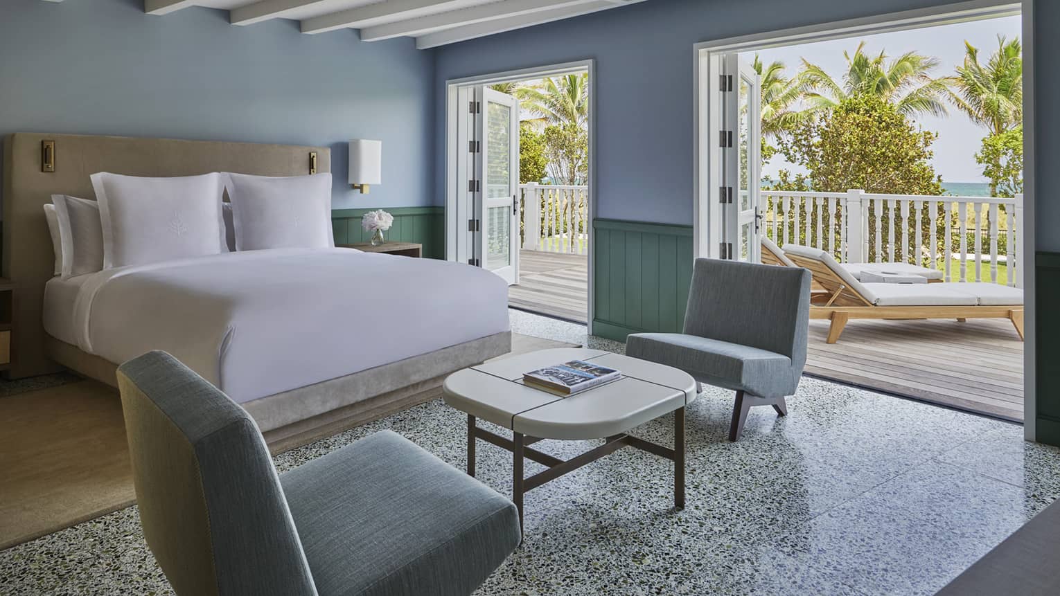 Beachfront Cabana Studio with terrazzo flooring, blue walls and balcony with ocean views