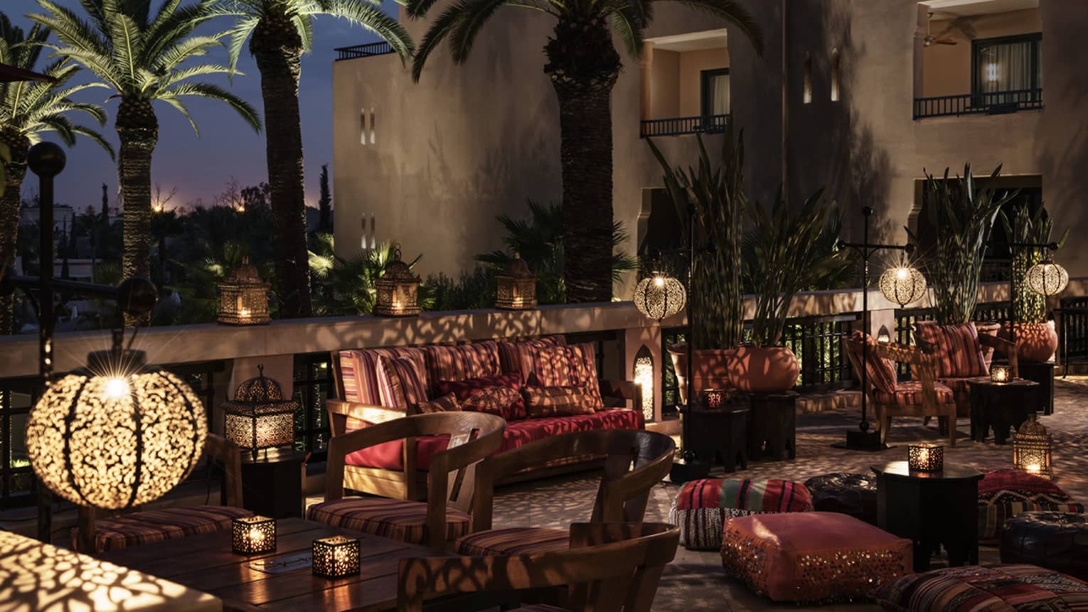 Inara Lounge dimly-lit patio seating areas with lights, shadows from Moroccan lamps