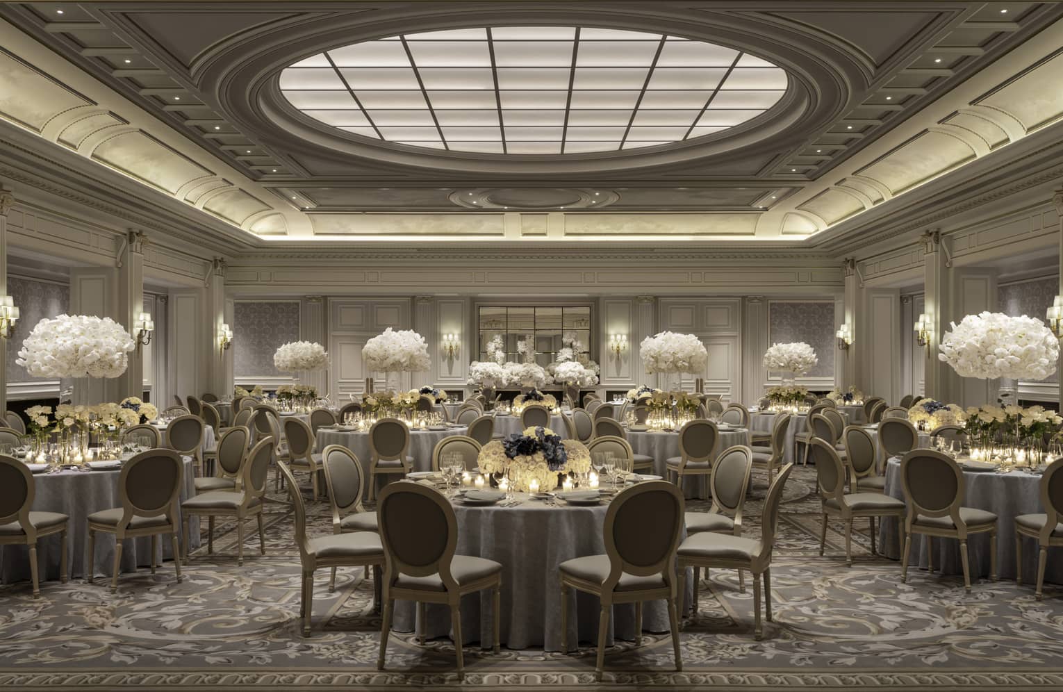 Elegant Paris banquet room, dining tables with white floral centrepieces under decorative domed ceiling