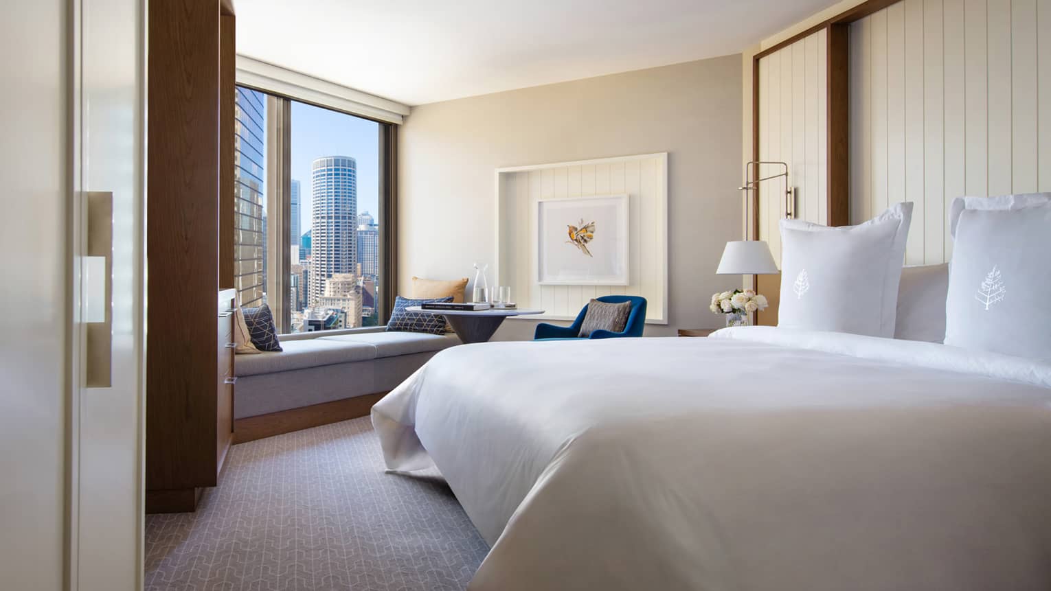 Hotel room with king bed and views of downtown Sydney